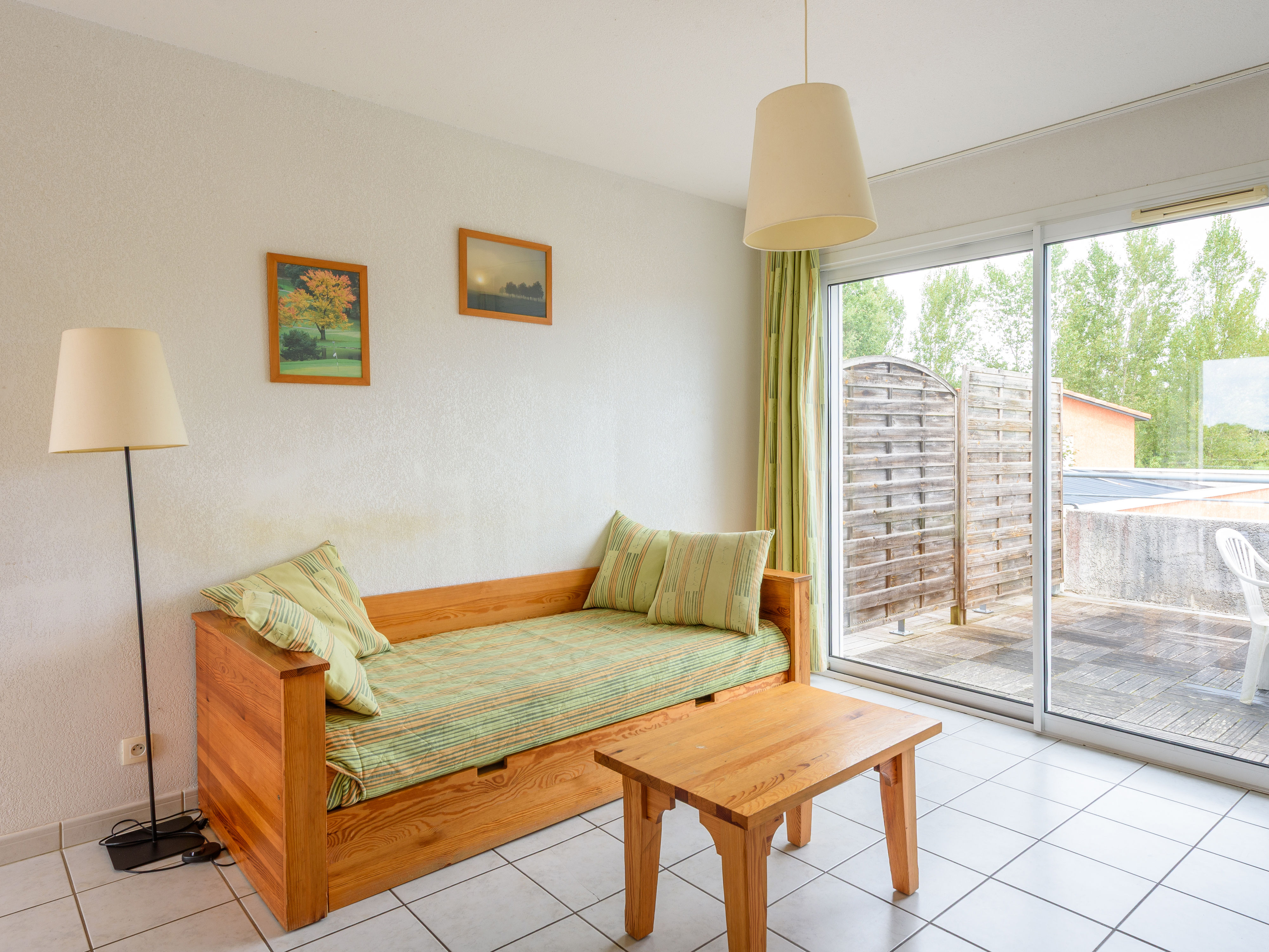 image A comfortable seating nook in the living area invites you to unwind with a book or enjoy conversations with family and friends.