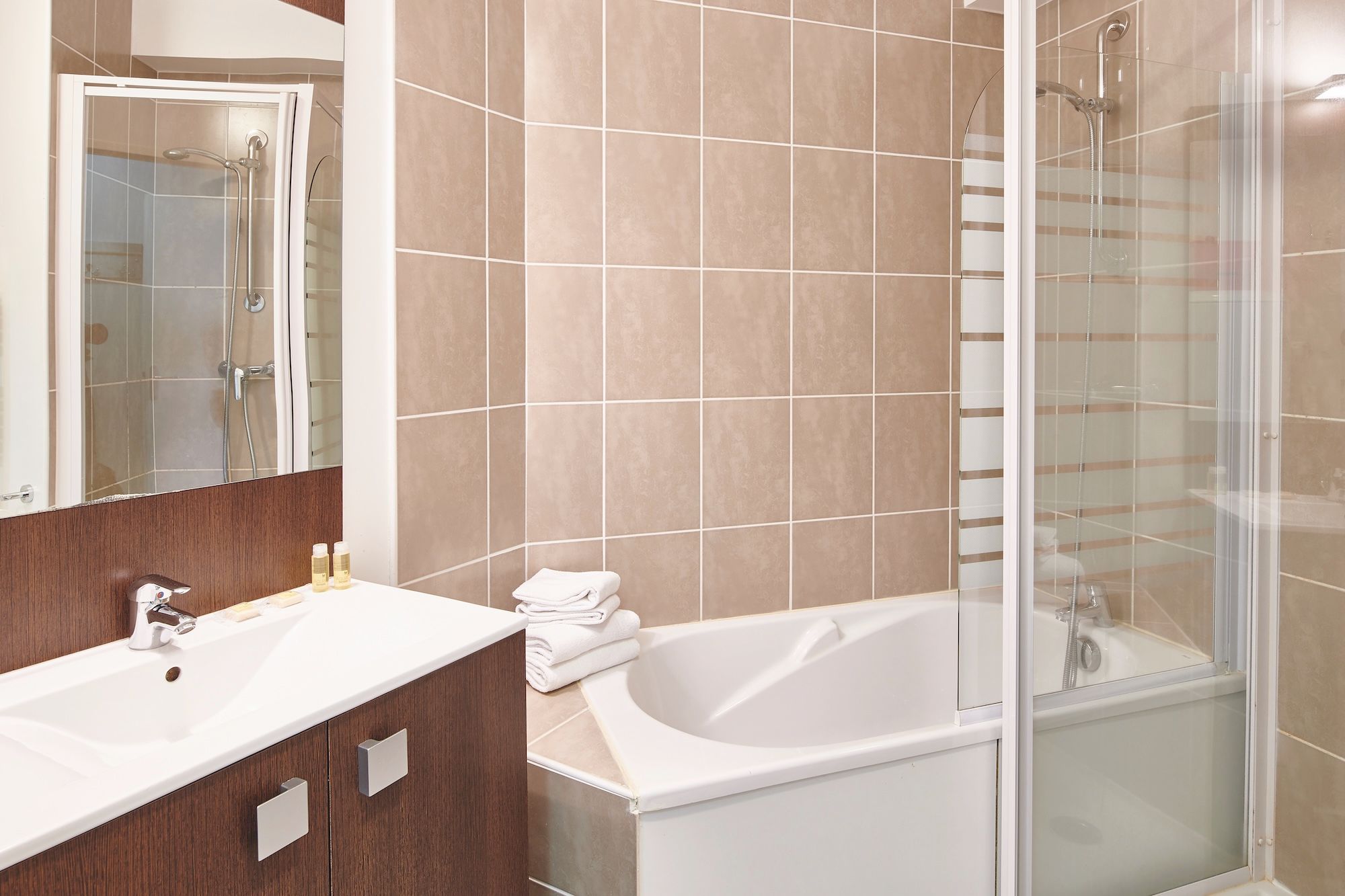 image Soak in the bathtub or rinse off in the separate shower, then get ready at the sink and mirror