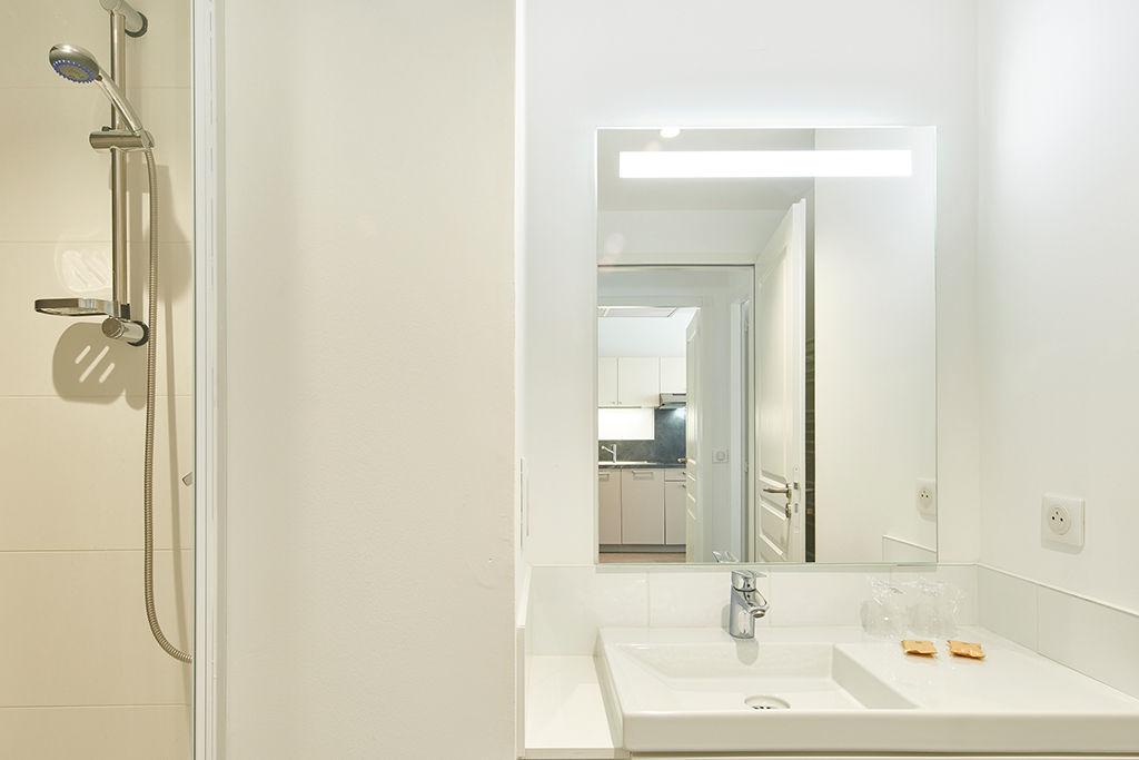 image Freshen up at the sink and mirror, then rinse off in the shower