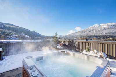 Unwind in your own private hot tub on your balcony after an exciting day on the mountain!