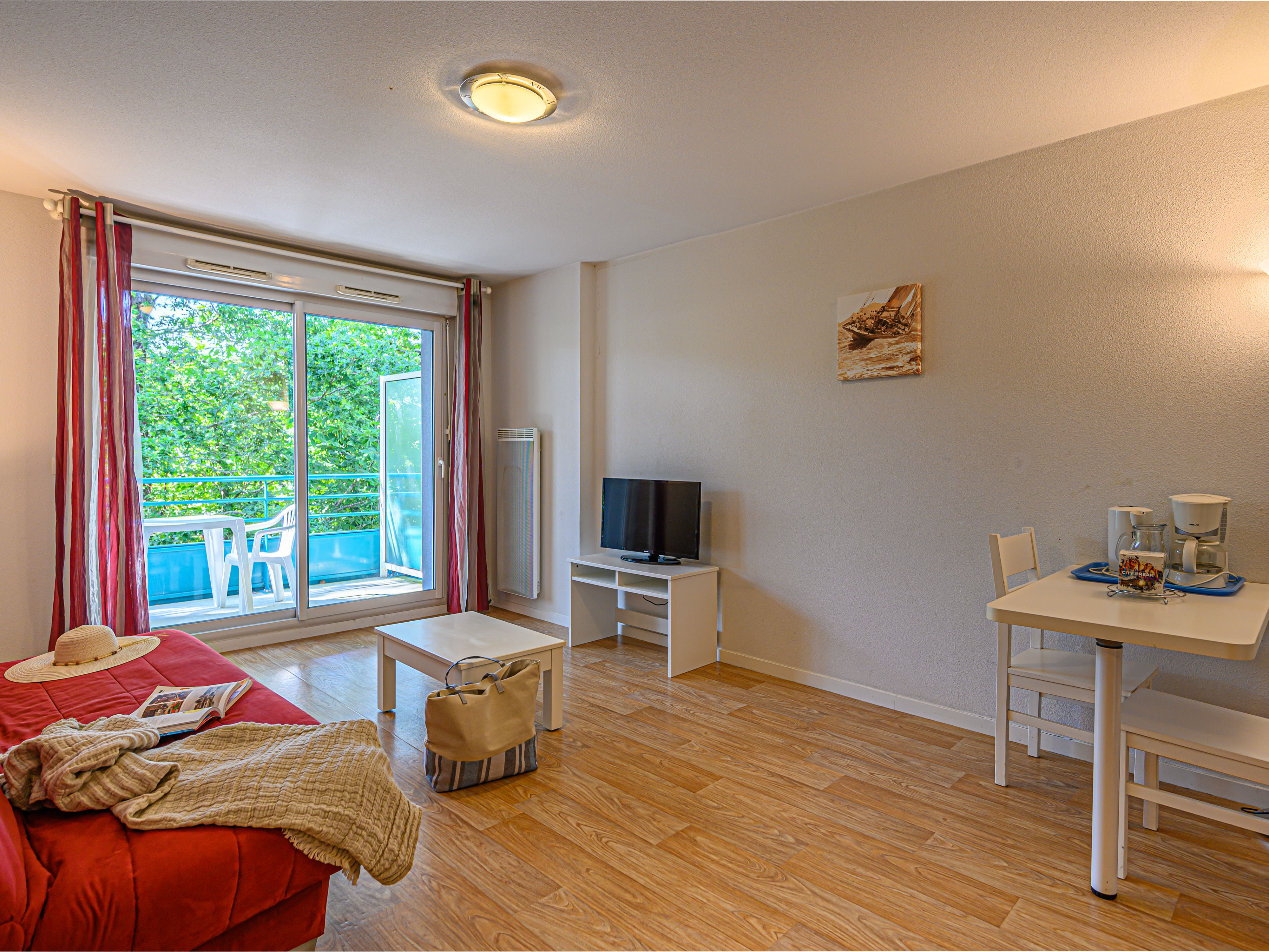 image Relax and the living space connecting to the dining table and outdoor space.