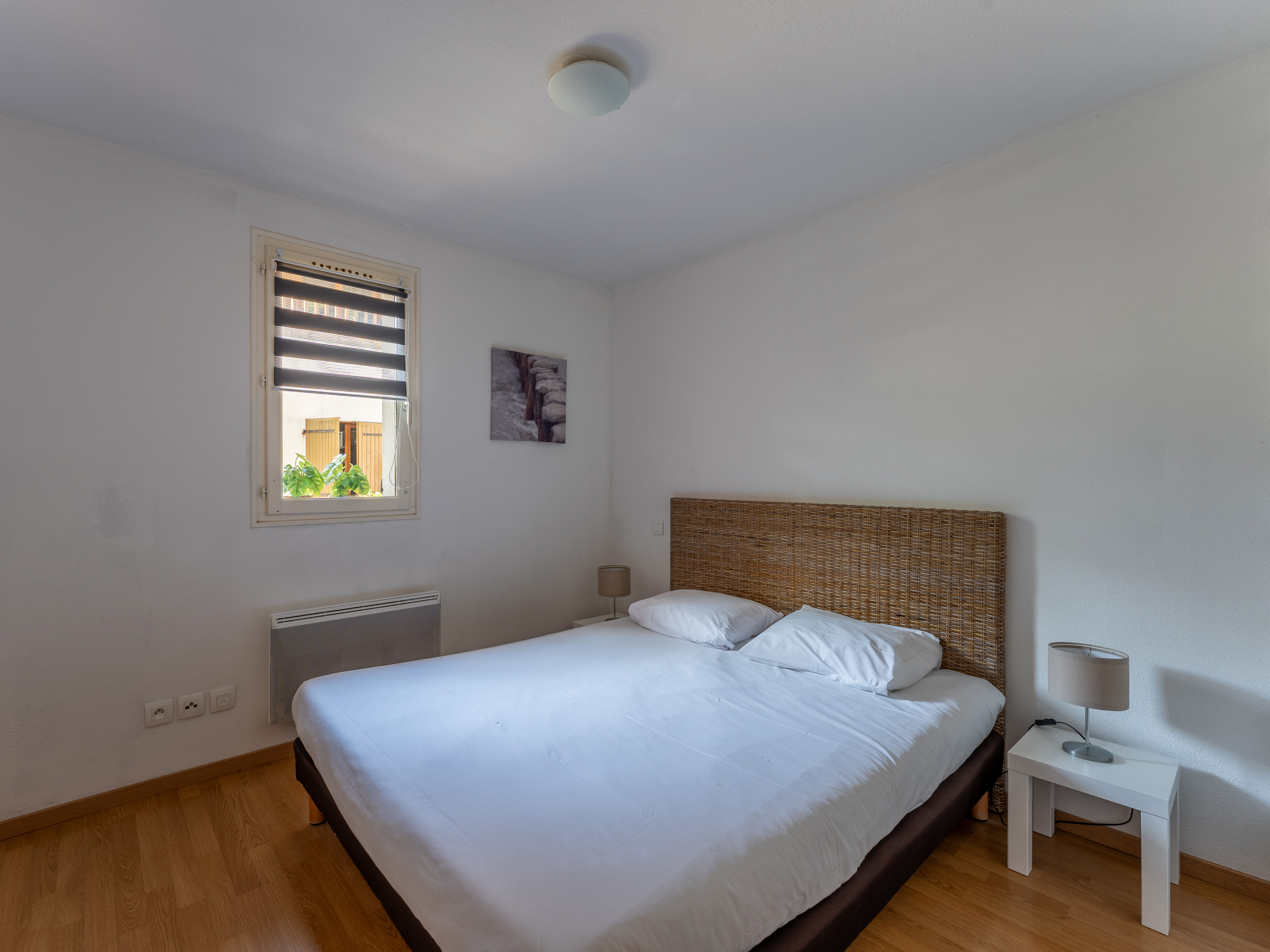 image The restful double bedroom, simply styled and ready for a good night's sleep after a day on the lake or the Atlantic beaches 6 km away.