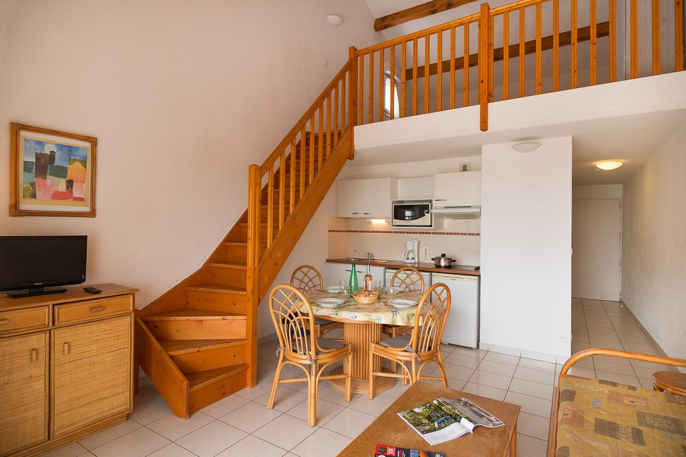 image Enjoy the warm and cozy decor of our apartment with a mezzanine.