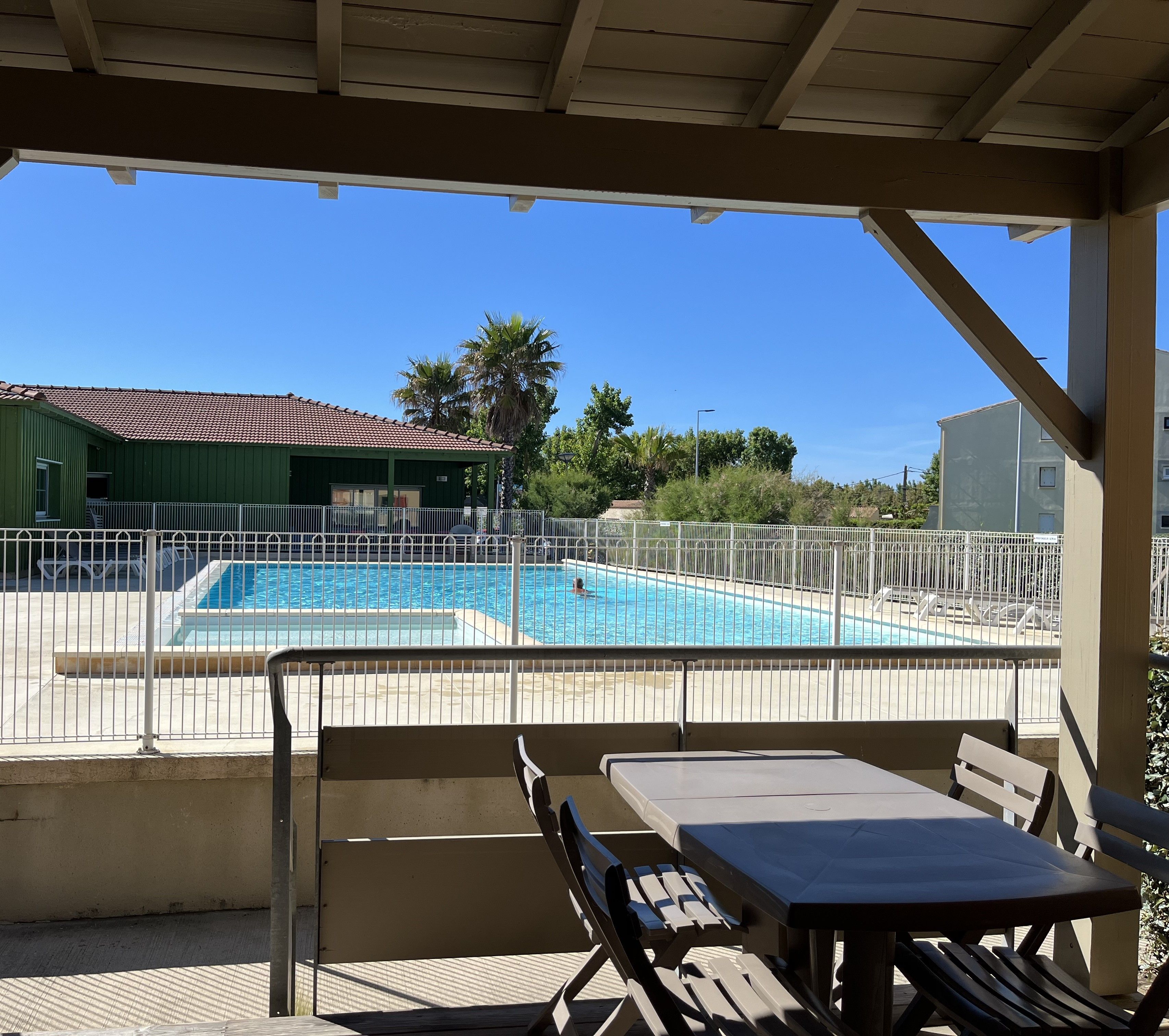 image Open from April to October, the shared pool sits under a covered patio just steps from your unit.