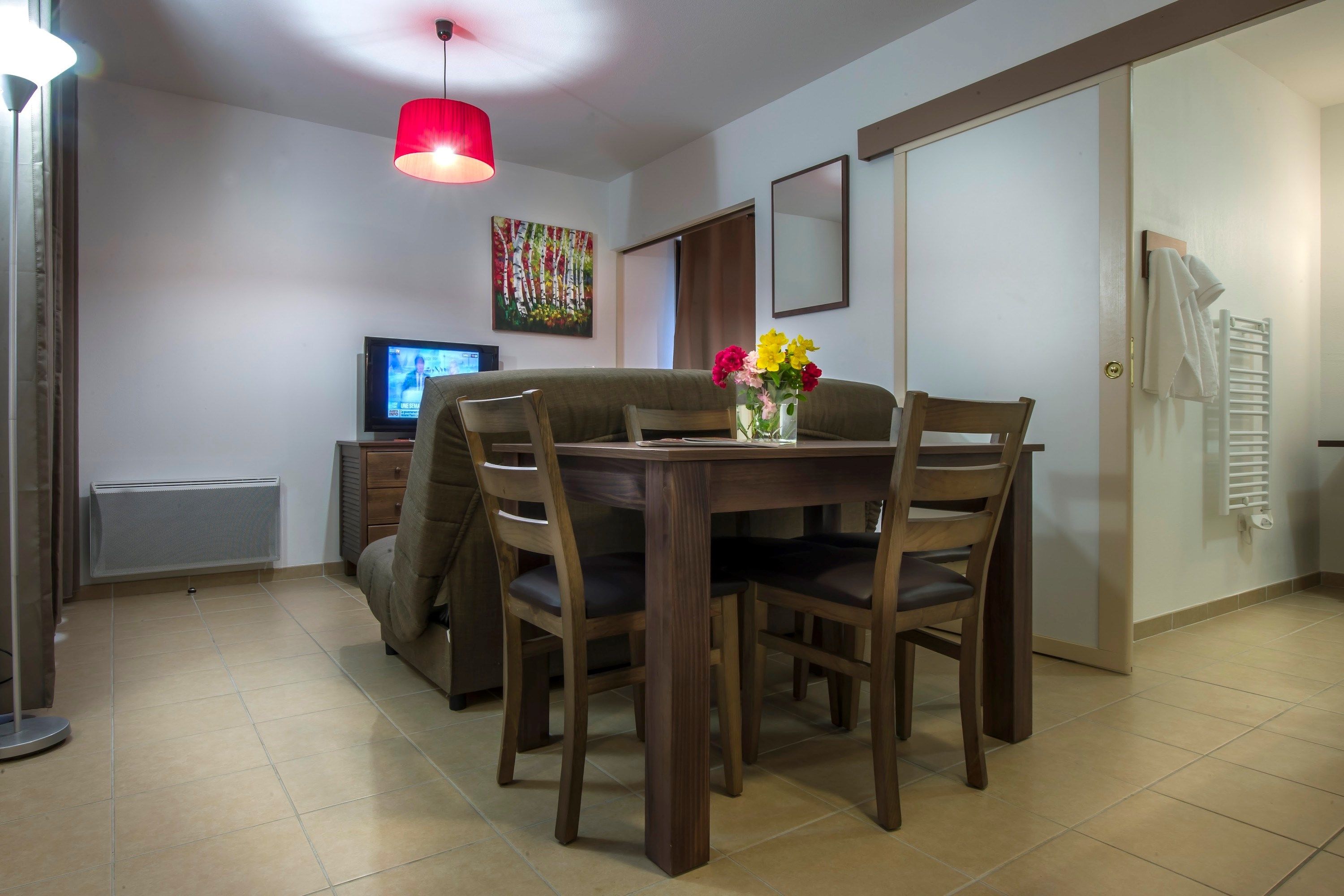 image Reconnect with loved ones over a meal at the dining table.