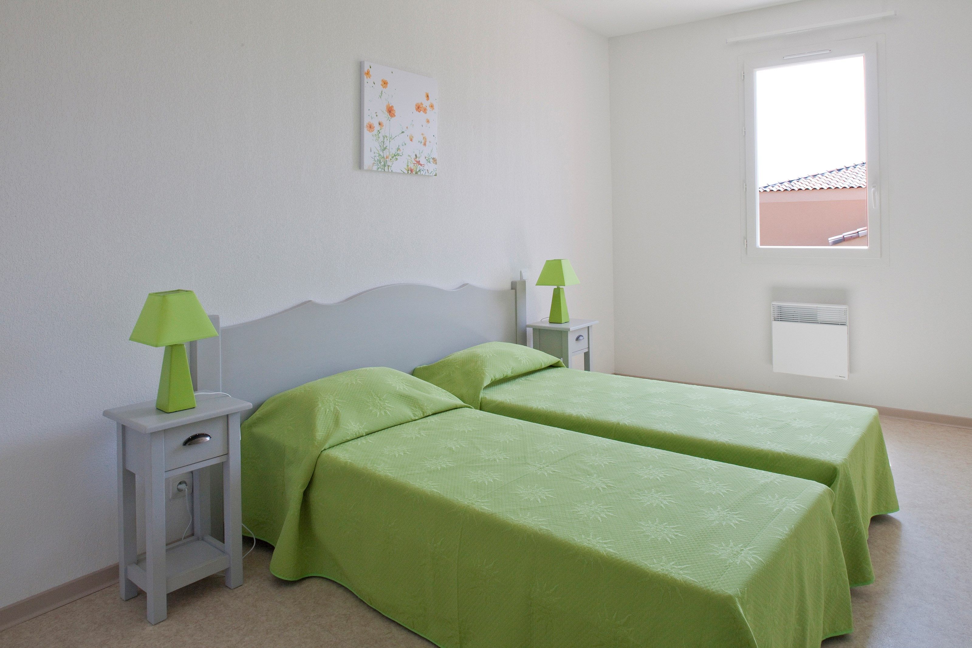 image There are 2 cozy bedrooms, one with 2 Single beds and the other with a Double bed.