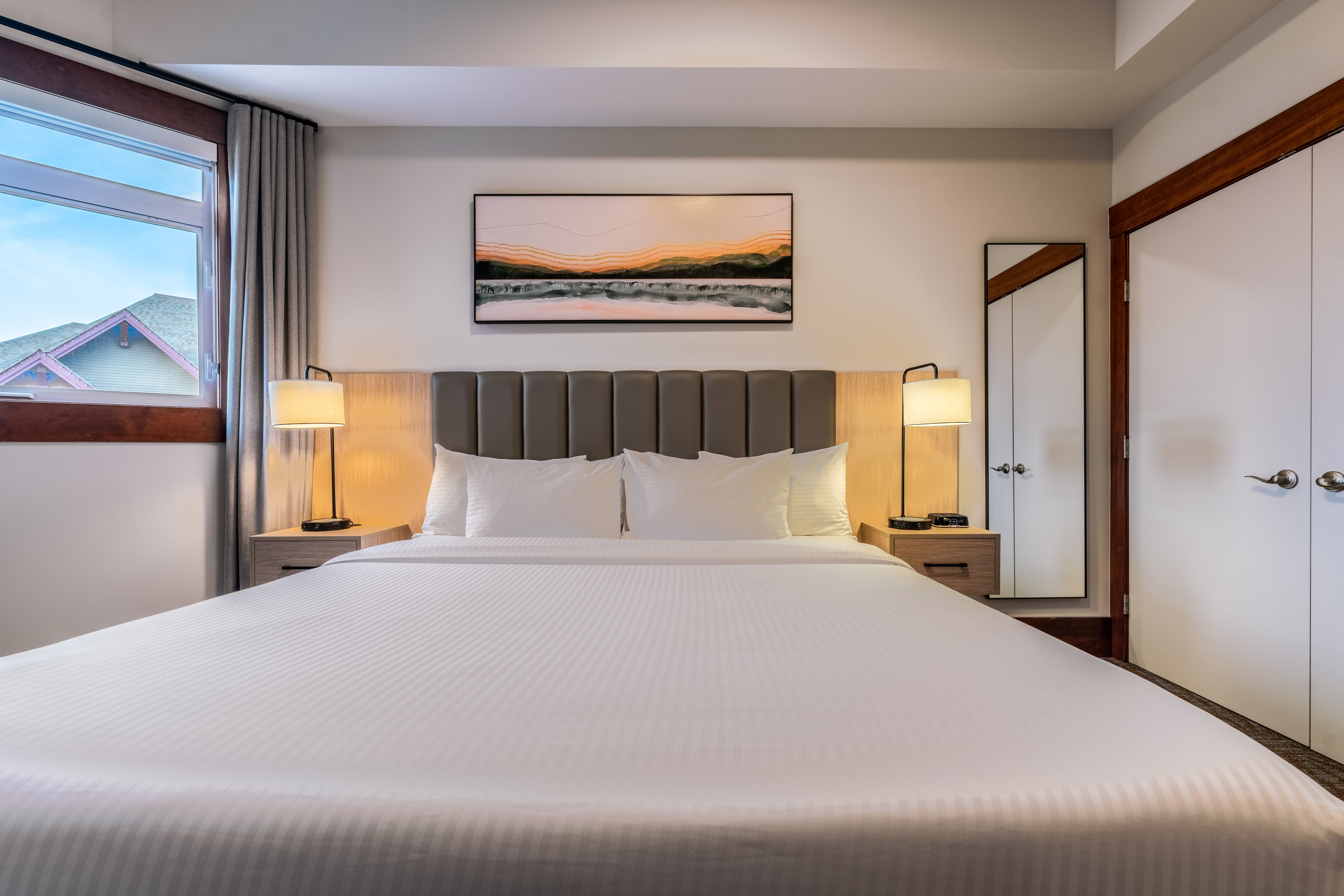 image A stylish and serene bedroom with soft lighting, plush bedding, and views to wake up to.