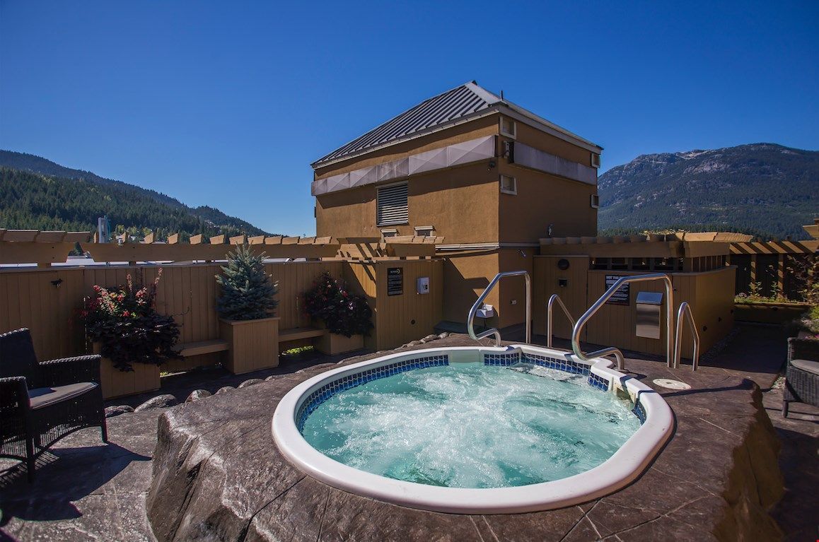 image Enjoy a serene escape in the rooftop hot tub, surrounded by stunning mountain views and fresh alpine air.