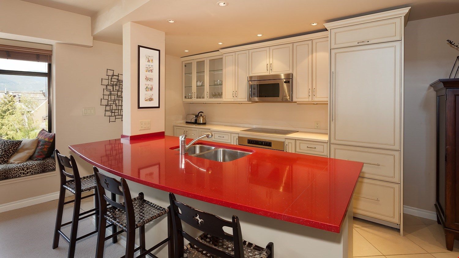 image The gourmet kitchen is fully-equipped, spacious, and allows you to join everyone in the living room for laughs and conversation!