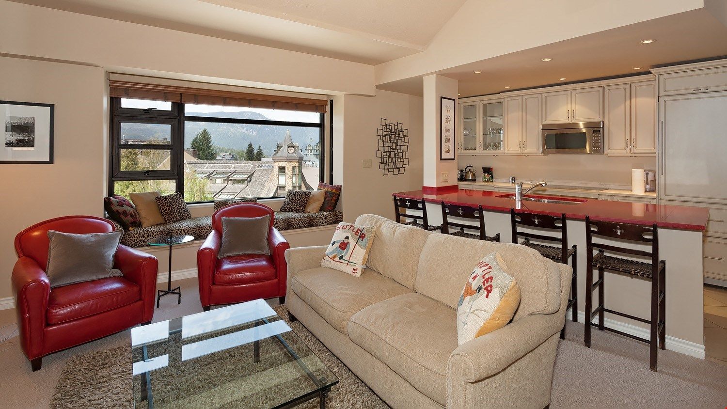 image The elegant style and loads of natural light in this living area make it a desirable place to reminisce about the day.