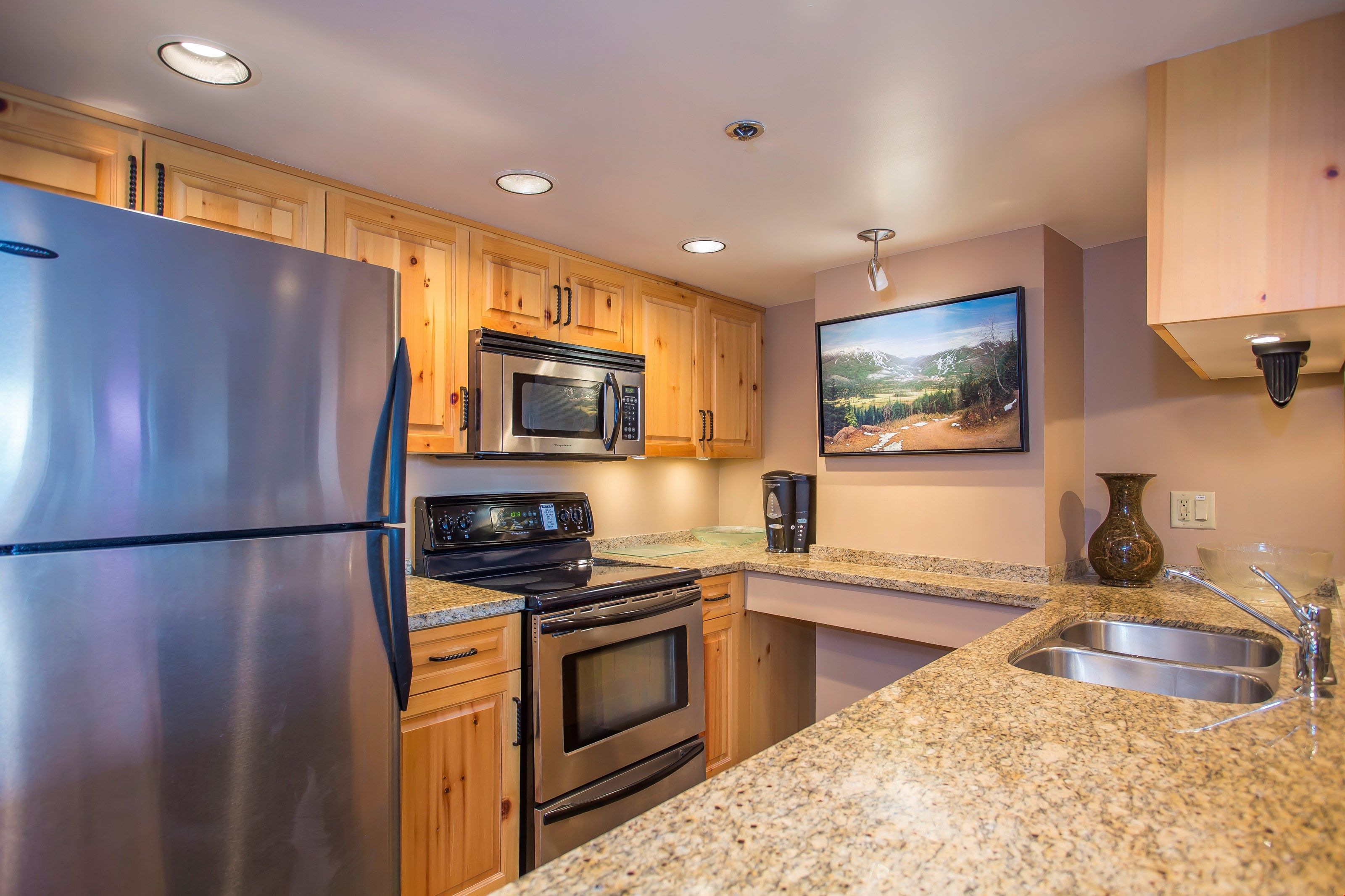 image The kitchen is fully-equipped, features granite countertops, and has an open-layout so you can still chat with company in the living room.