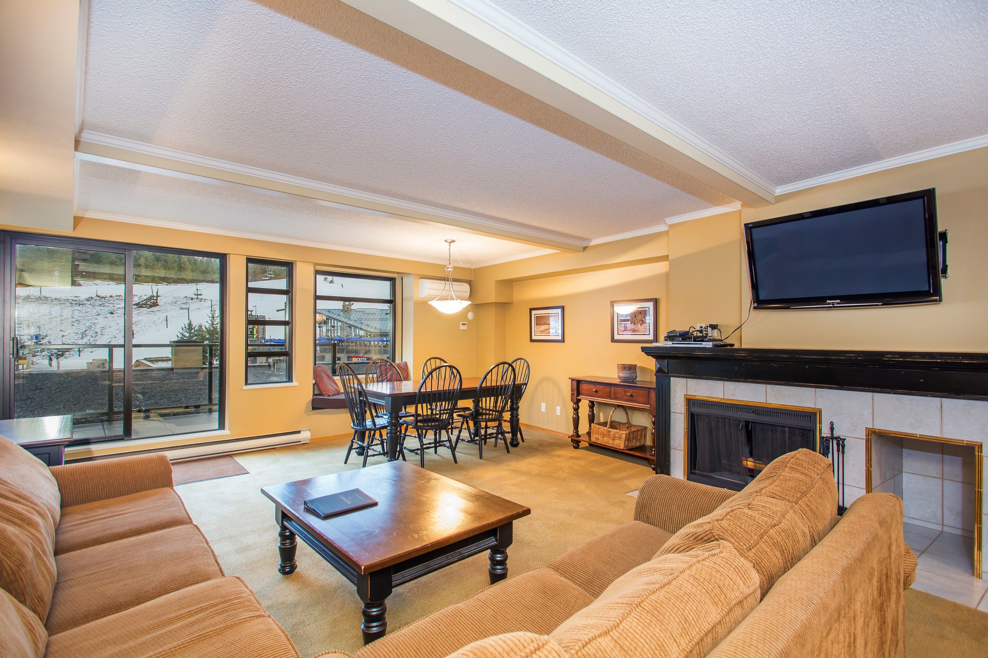 image Enjoy the cozy wood-burning fireplace and the mountain views from your balcony.
