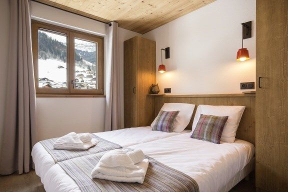 image Get a good night's rest in the cozy bedroom which features 2 Single beds which can be made into a Double bed.