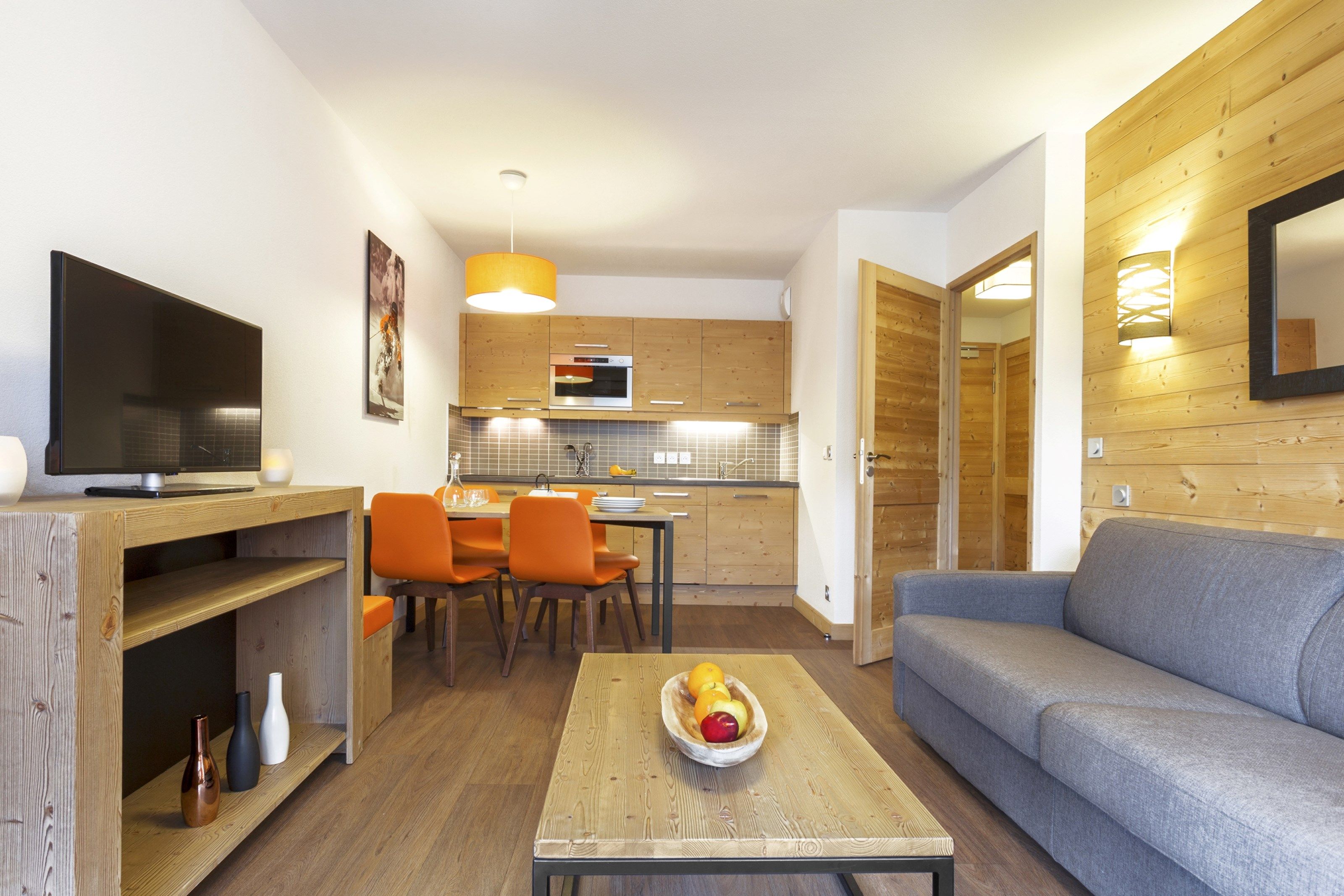 image Find peace and relaxation with your close friends and family in this stunning living room featuring natural decor.