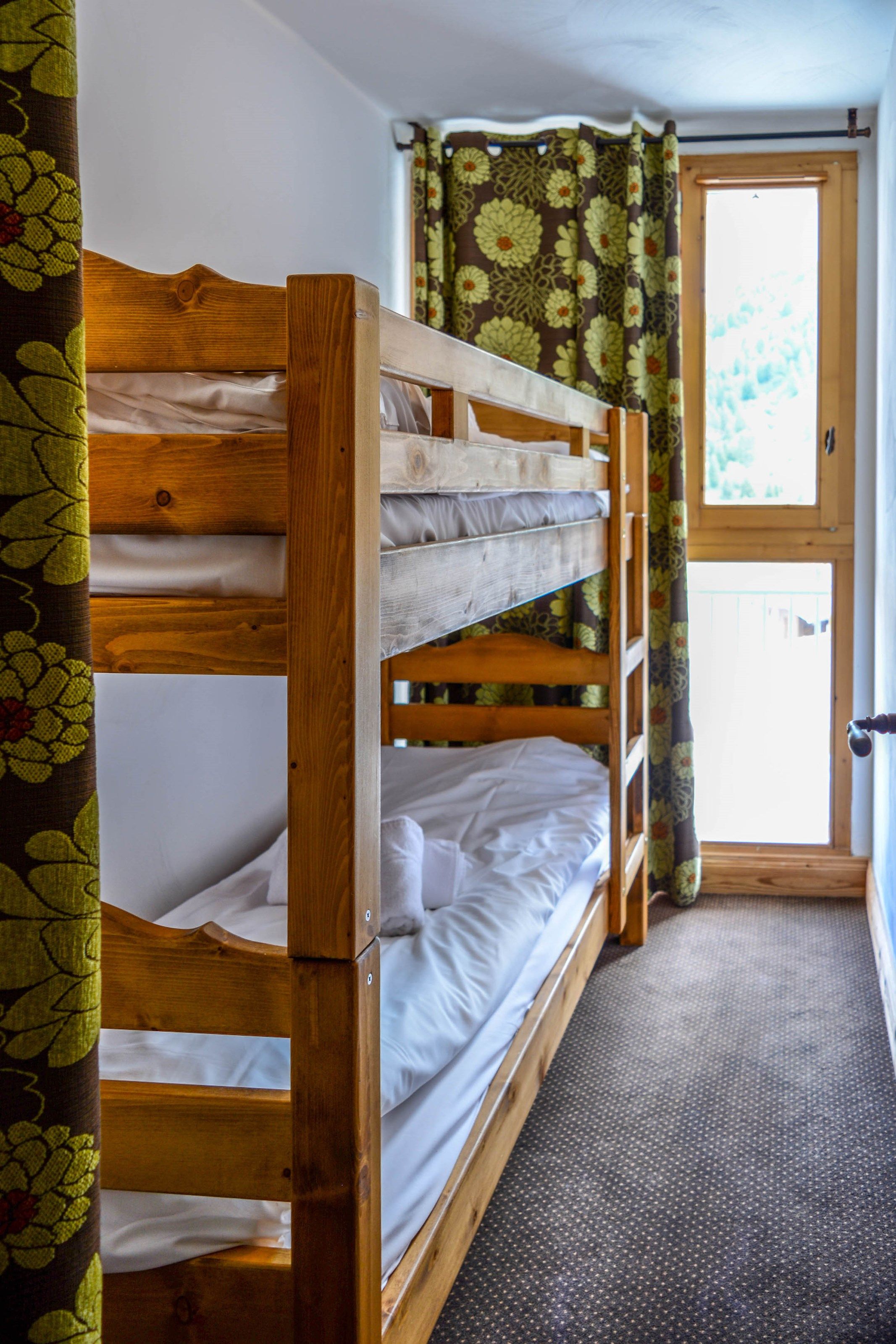 image The sleeping alcove contains a bunk bed.