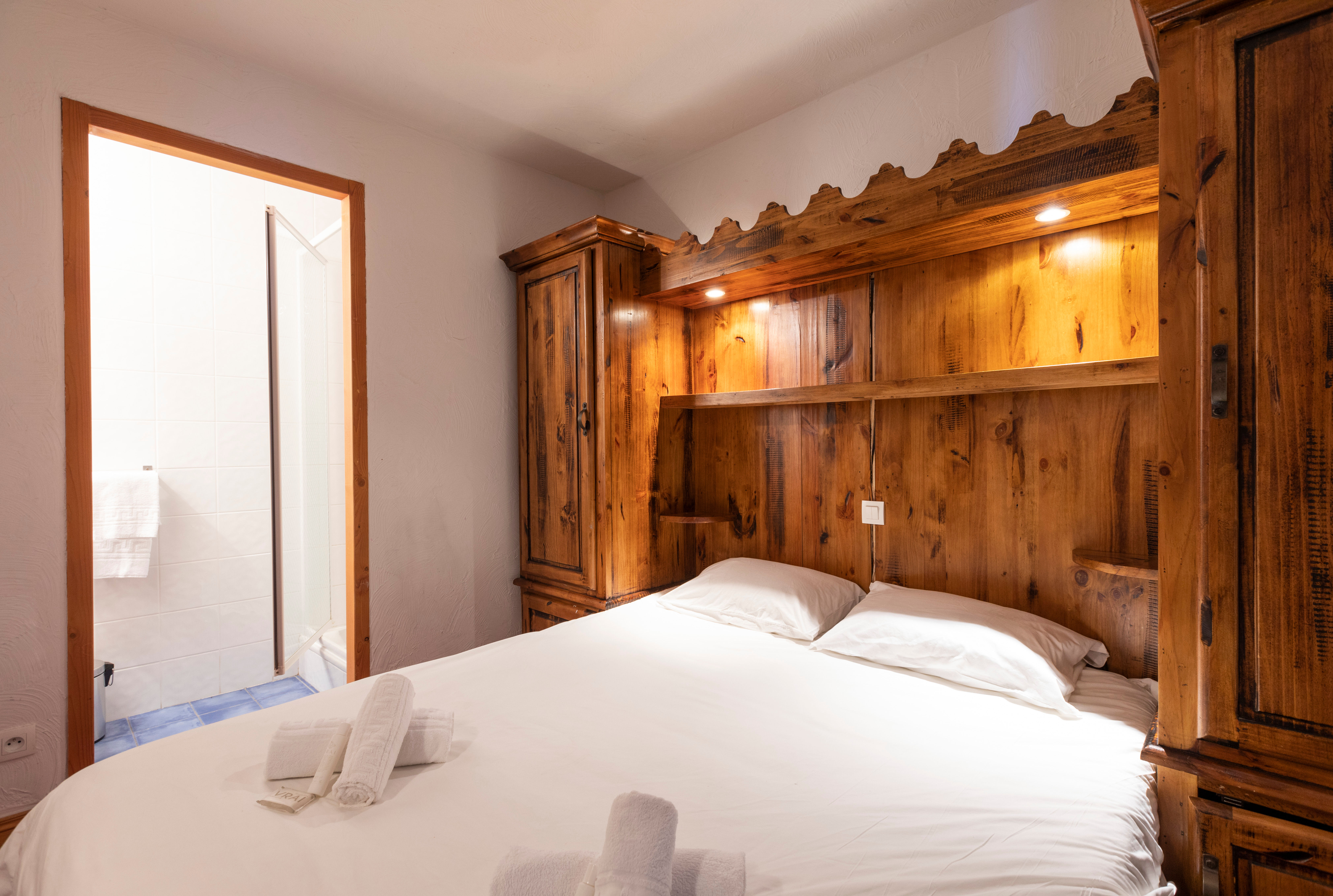 image Sink into crisp white linen and warm wood after a day on the pistes.