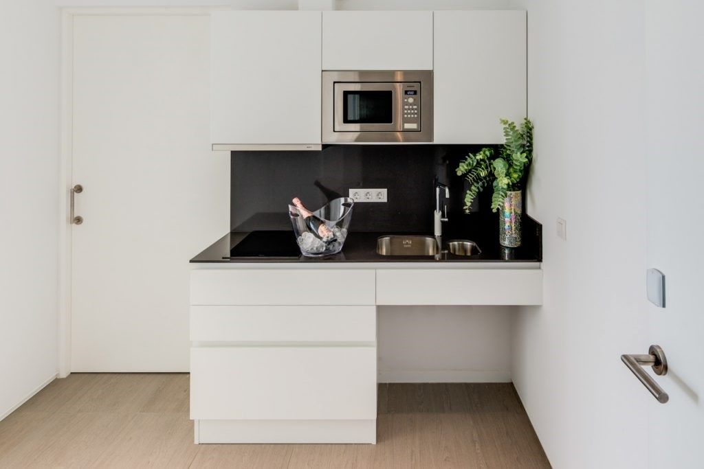 image Prepare a meal in the equipped kitchen.