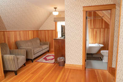 This bedroom is equipped with a TV and ensuite bathroom.