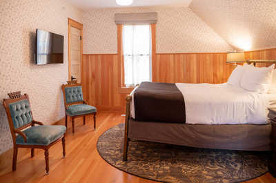 Relax on the comfy bed after a day outside and watch TV.