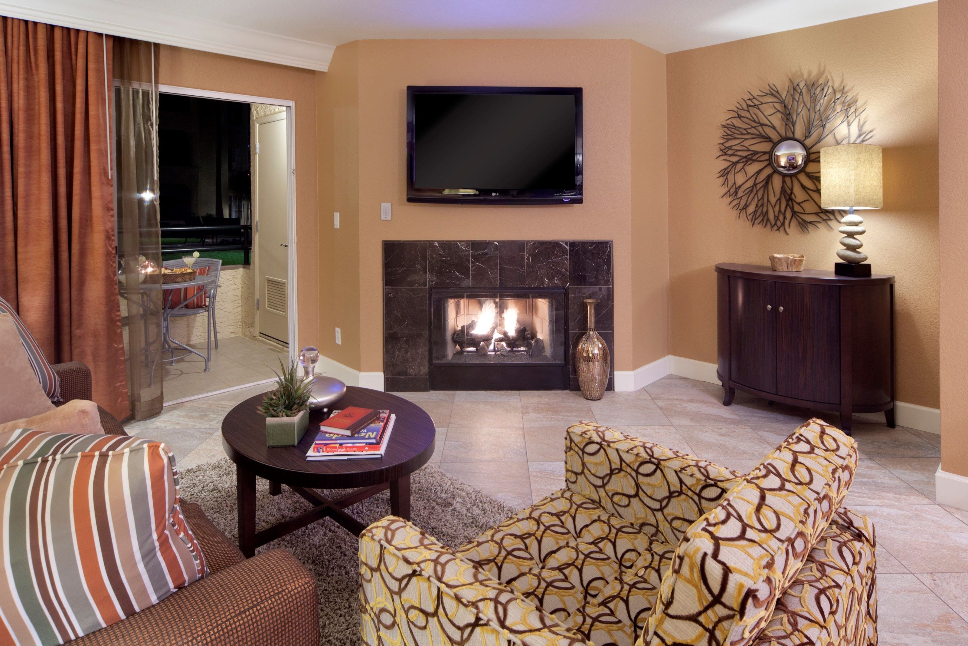 image Take a seat in front of the fireplace and enjoy a movie in the living area.