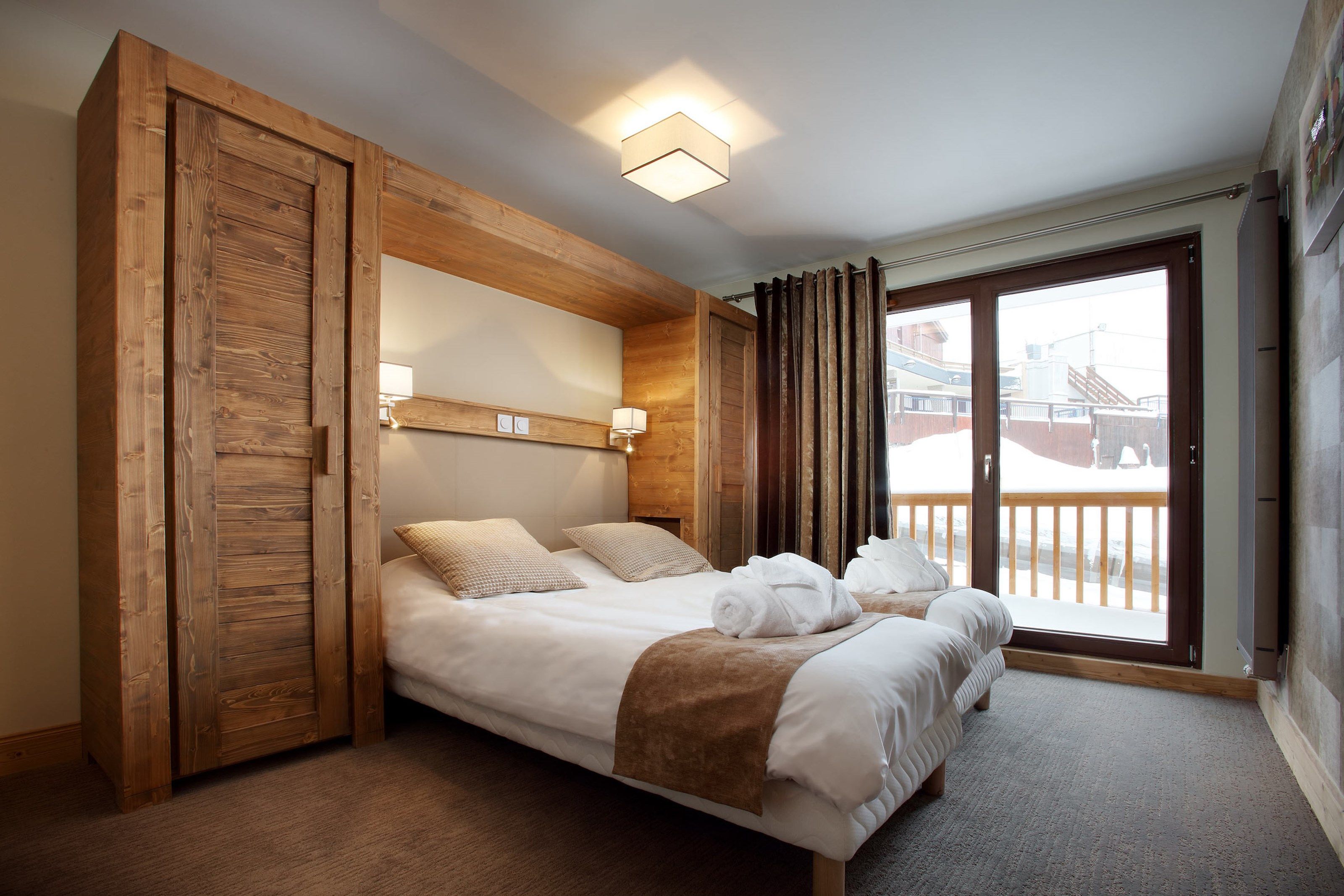 image The second bedroom features 2 Single beds.