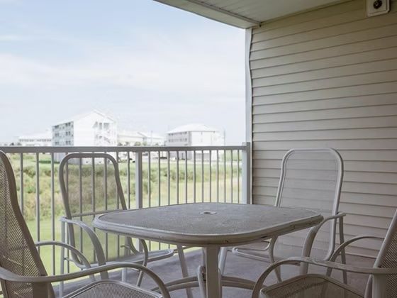 image Morning coffee on the private balcony, surrounded by treetop views and open sky
