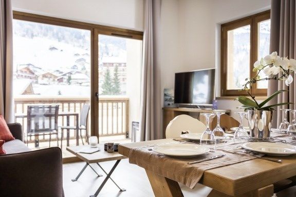 image Settle into the dining area and enjoy a nice meal.