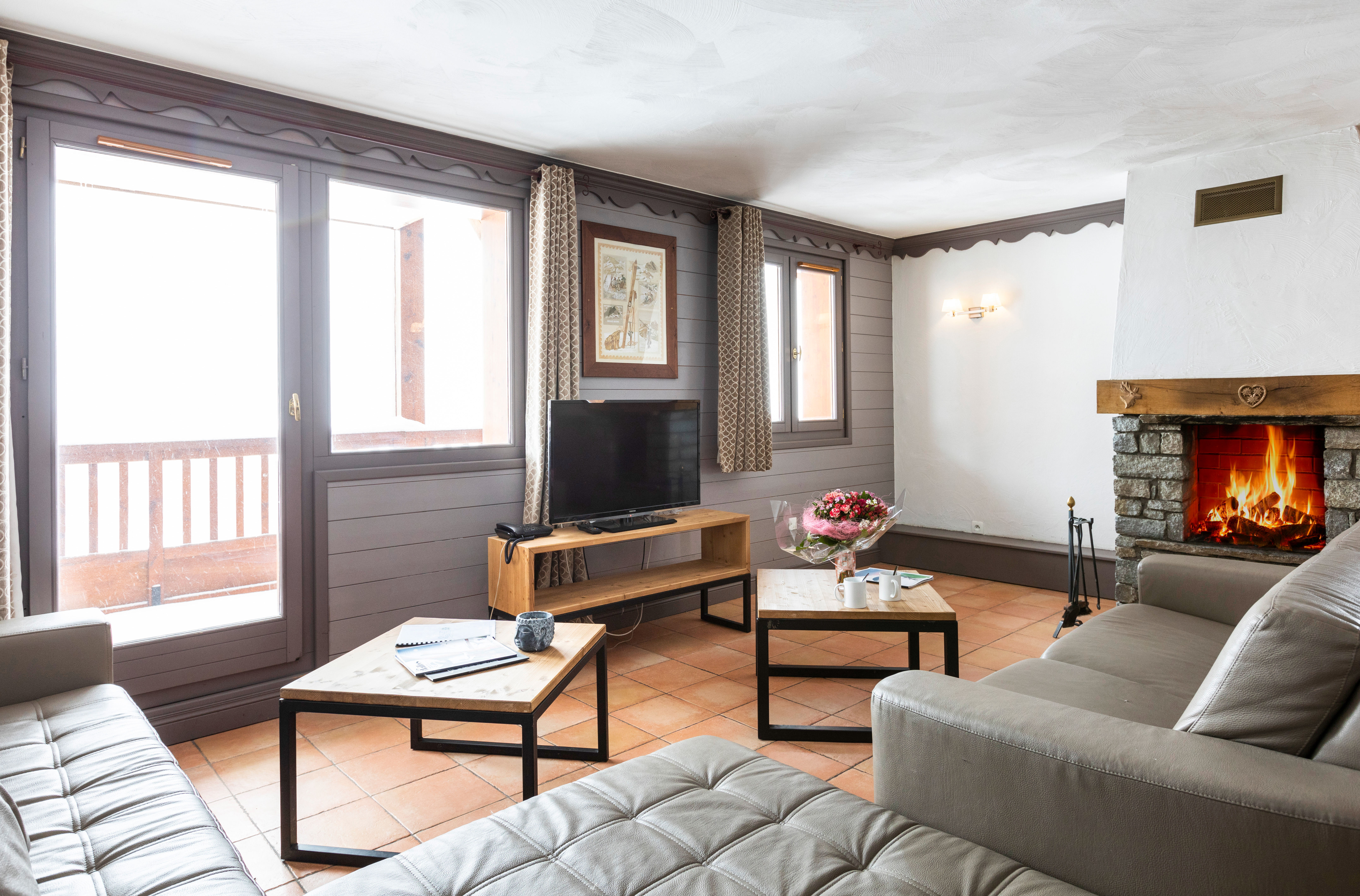 image Unwind by the fireplace with the balcony beside you.