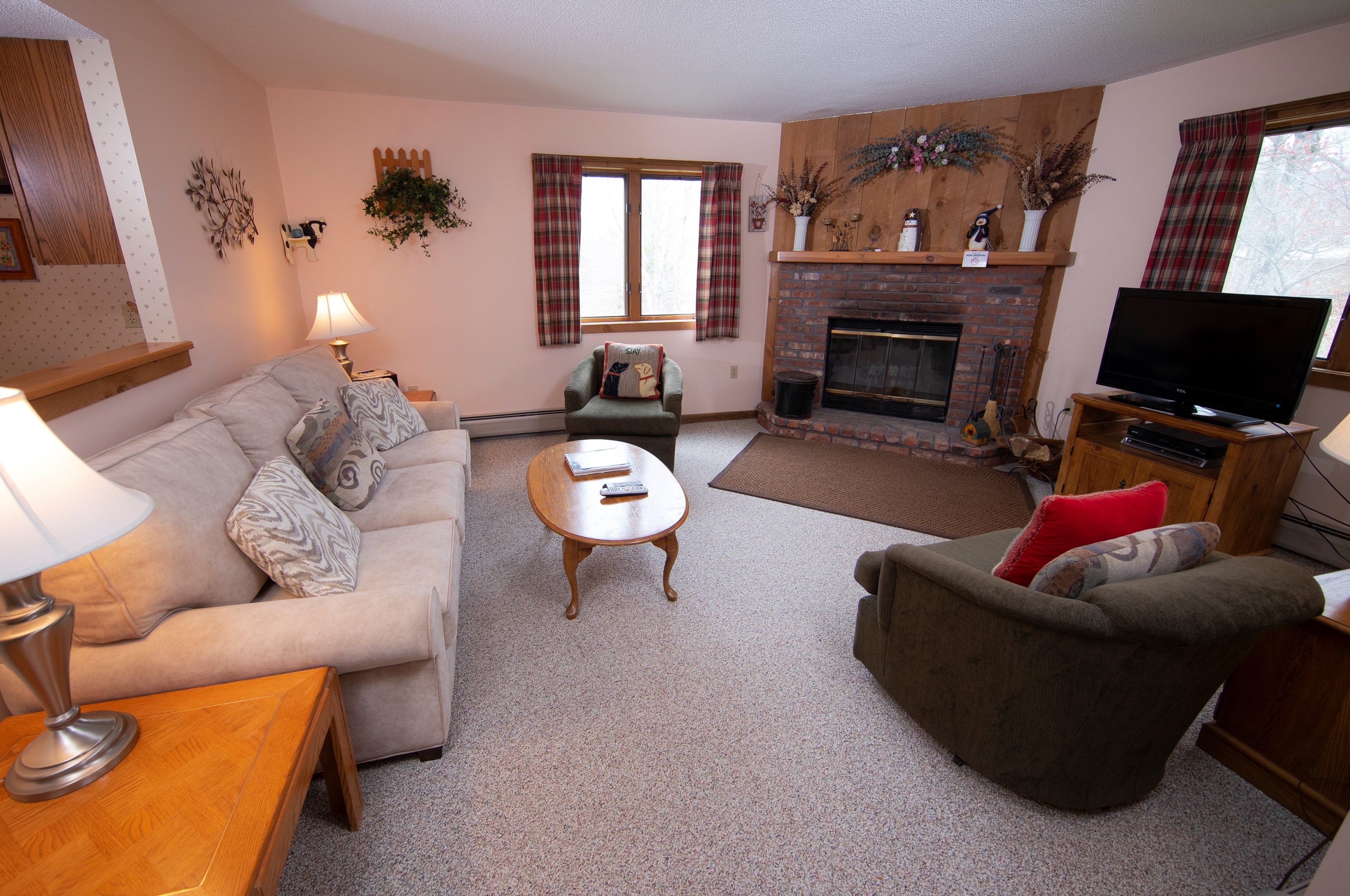 image Sit back and relax in our cozy living area! (Please note that decor varies).