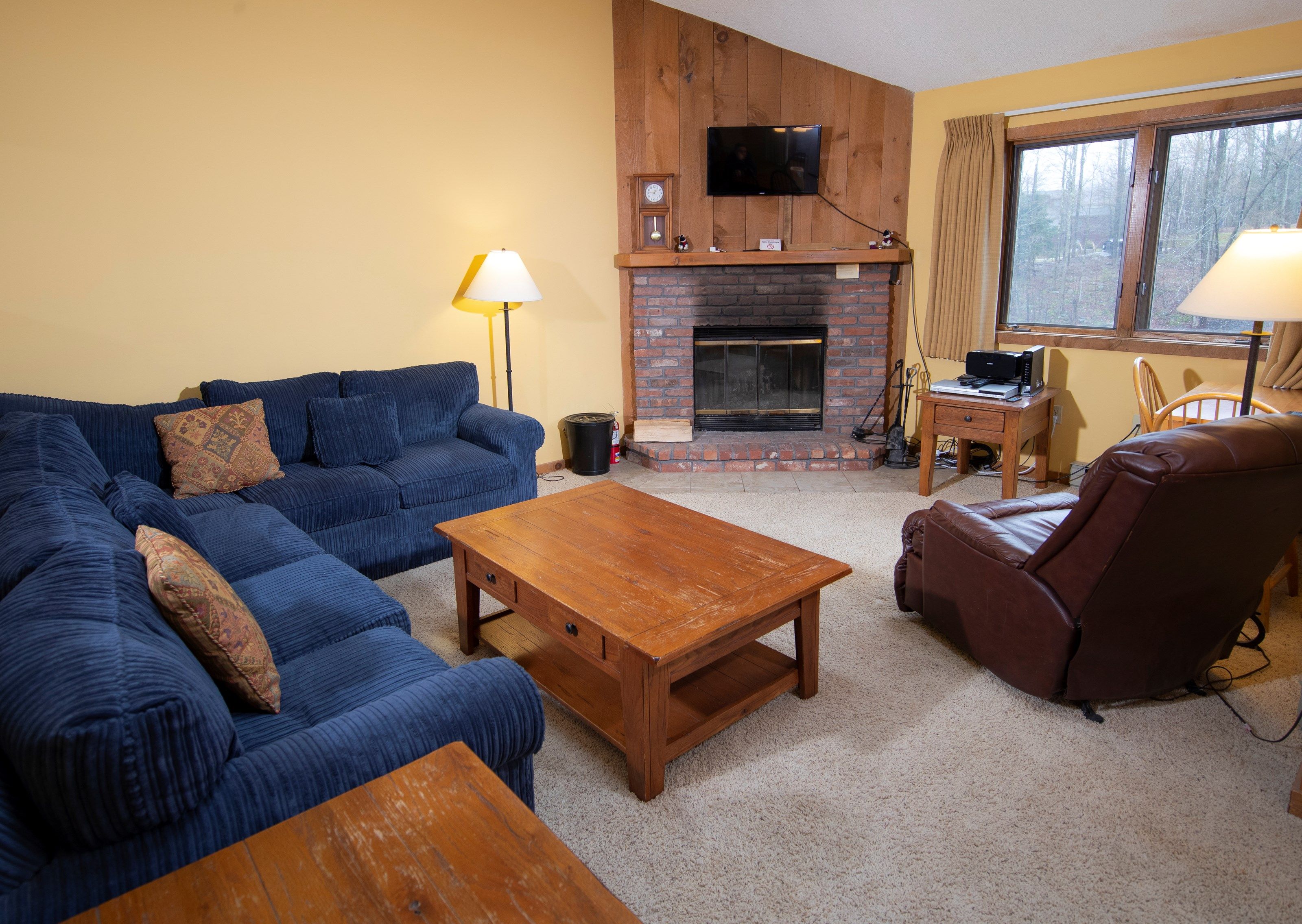 image Sit back and relax in the cozy living area after a great day. (Please note that the decor varies).