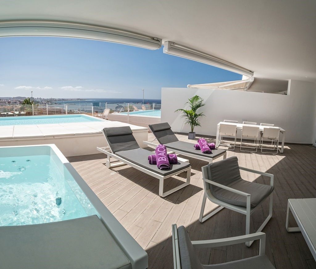 image Soak up the sunshine by your private pool.