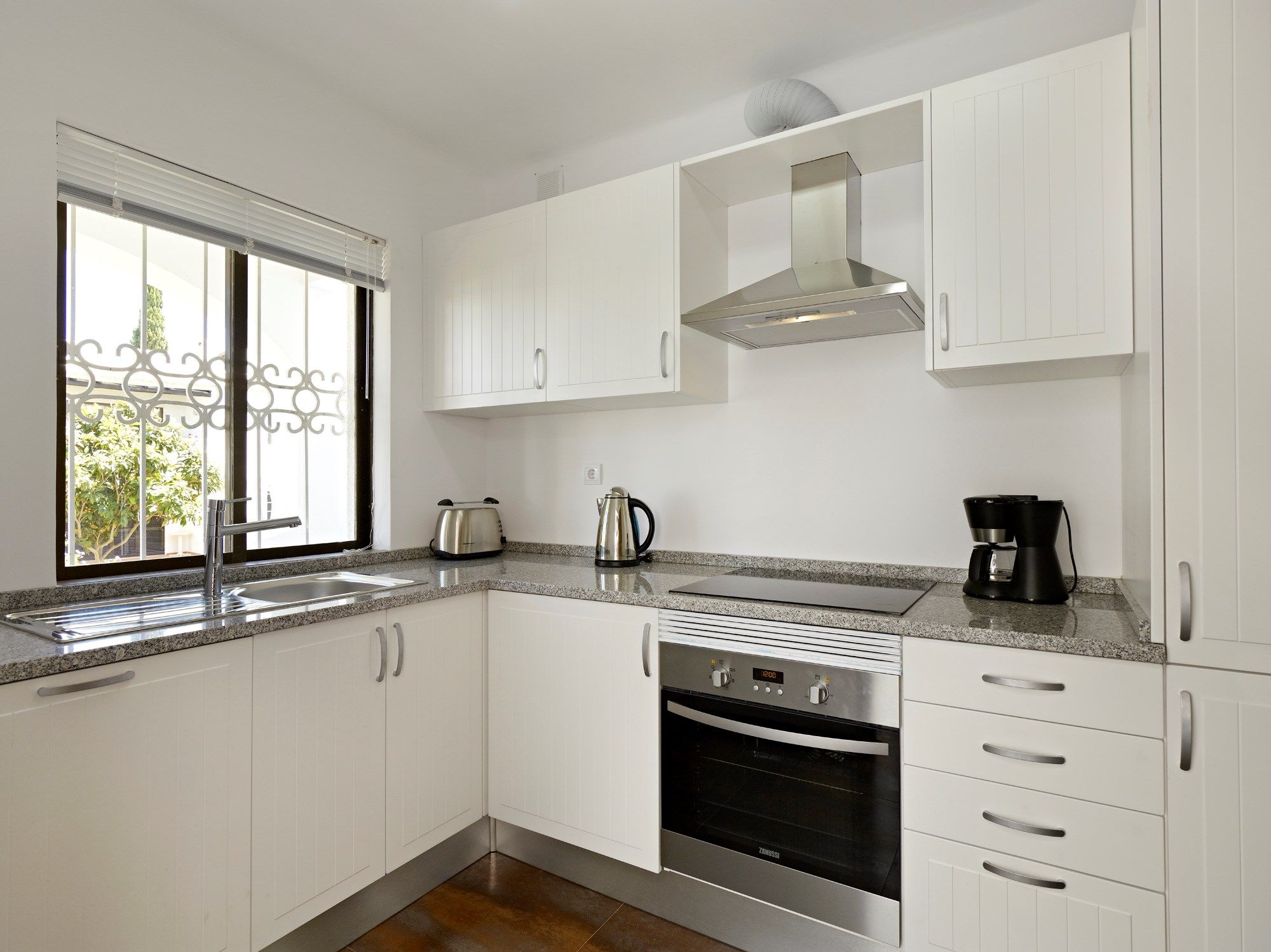 image Curb your appetite by cooking a meal in your kitchen.