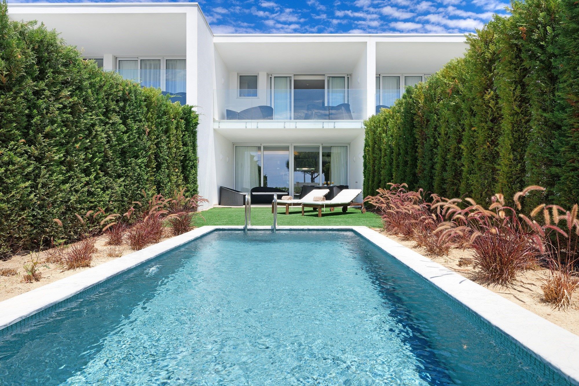image Take in gorgeous views while lounging around the on-site outdoor pool