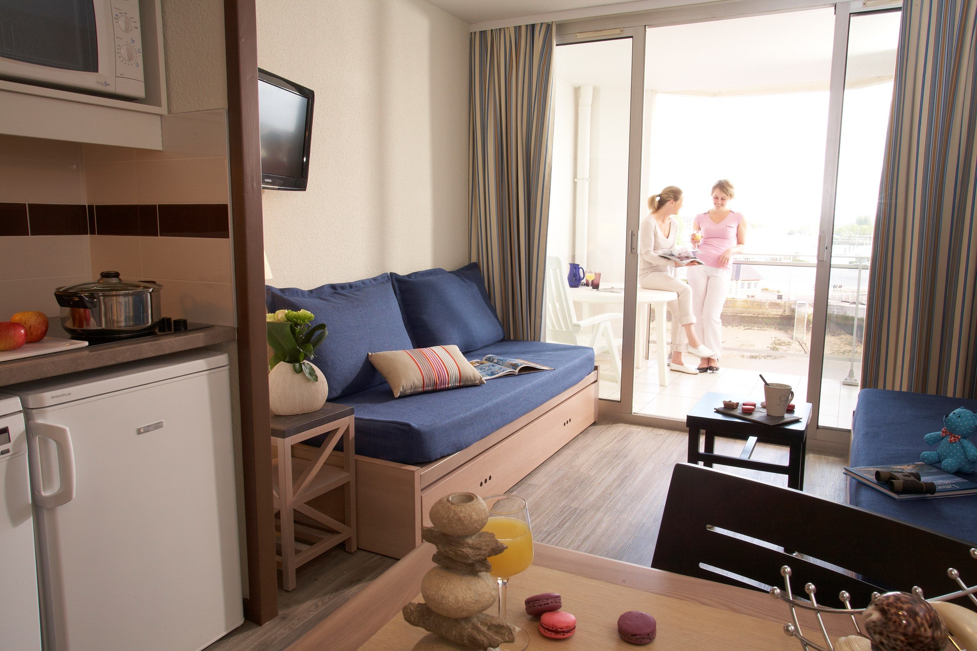 image The living area is bright and cozy, perfect for relaxing after a day on the beach.