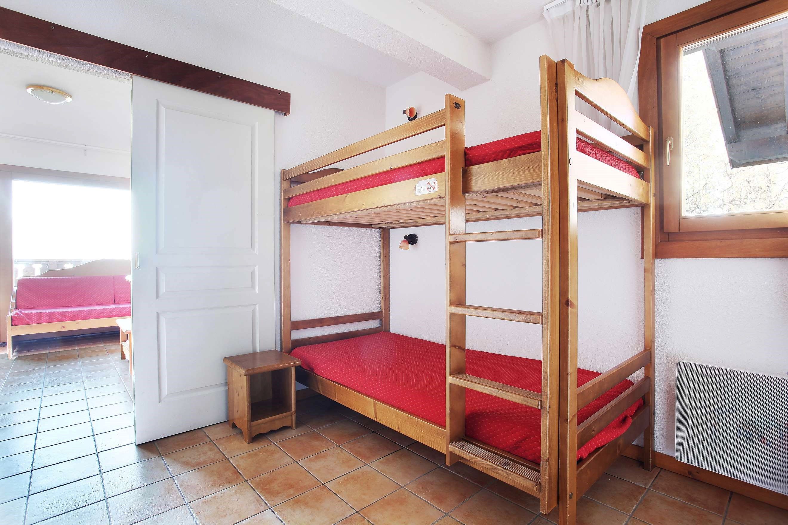 image The sleeping alcove features a Bunk bed.