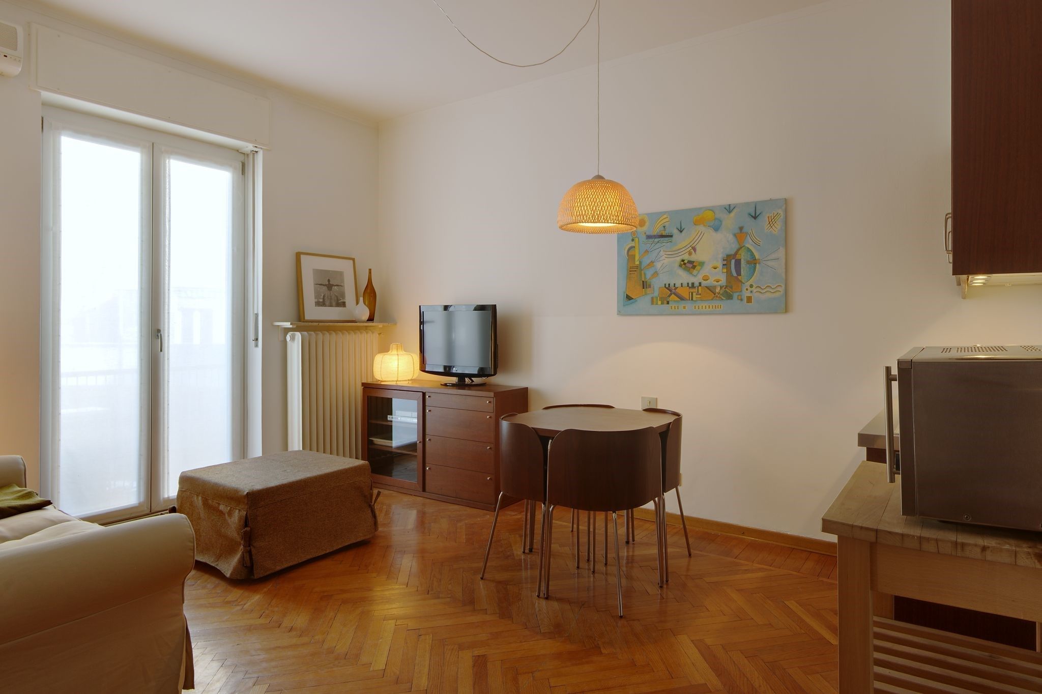 image Find peace and relaxation with your close friends and family in this stunning living room featuring natural decor.