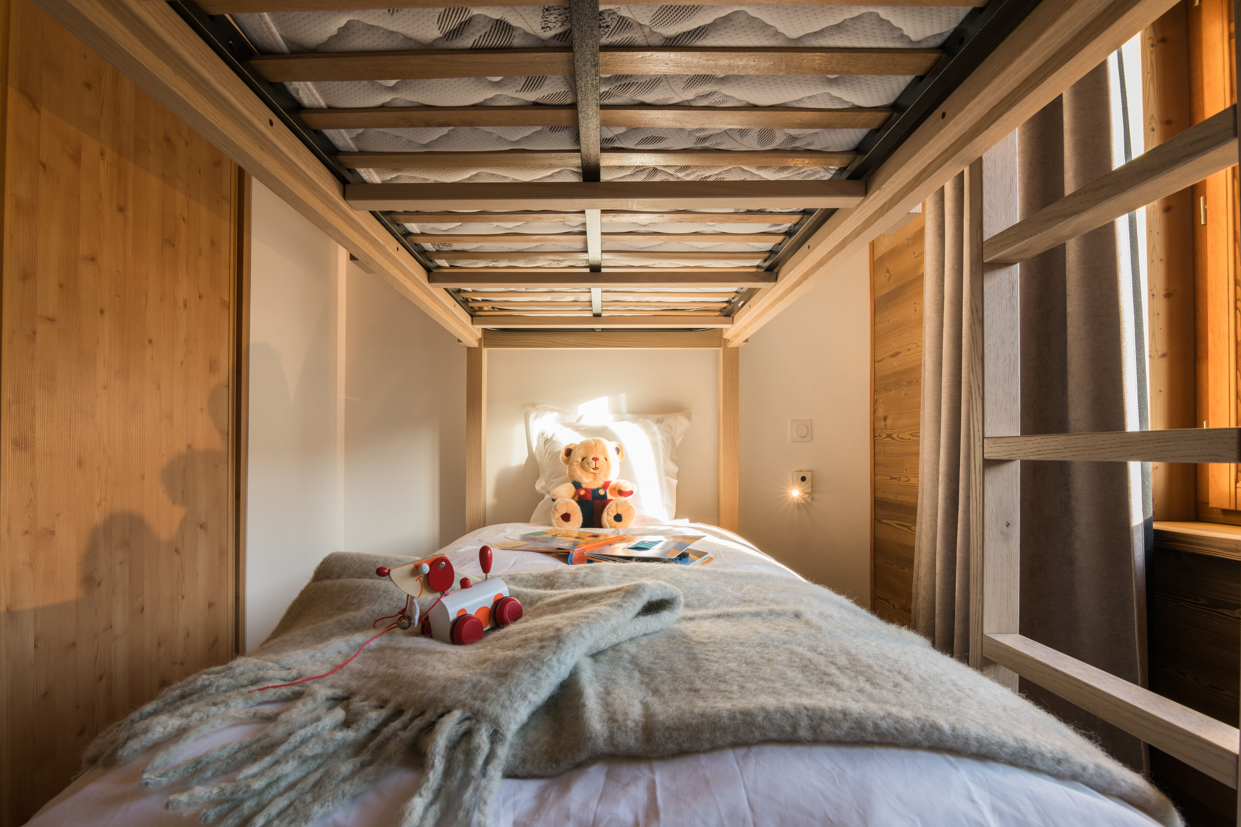 image Comfy bunk bed with soft bedding, perfect for a peaceful night’s sleep.