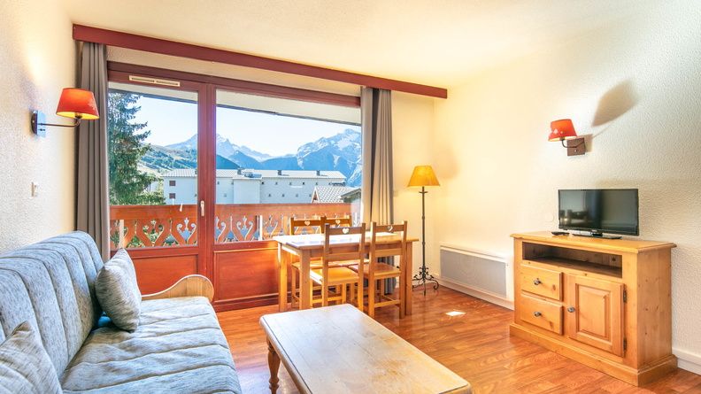 image Kick back your feet and relax in the cozy living area while watching some TV.