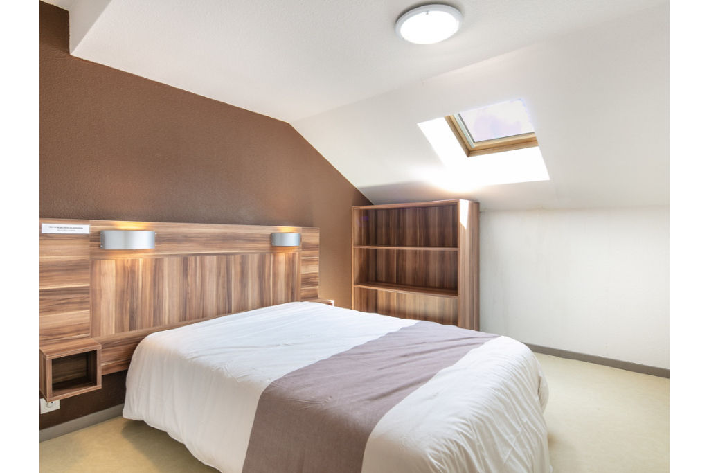 image Relax on the comfy Double bed after a day outside.