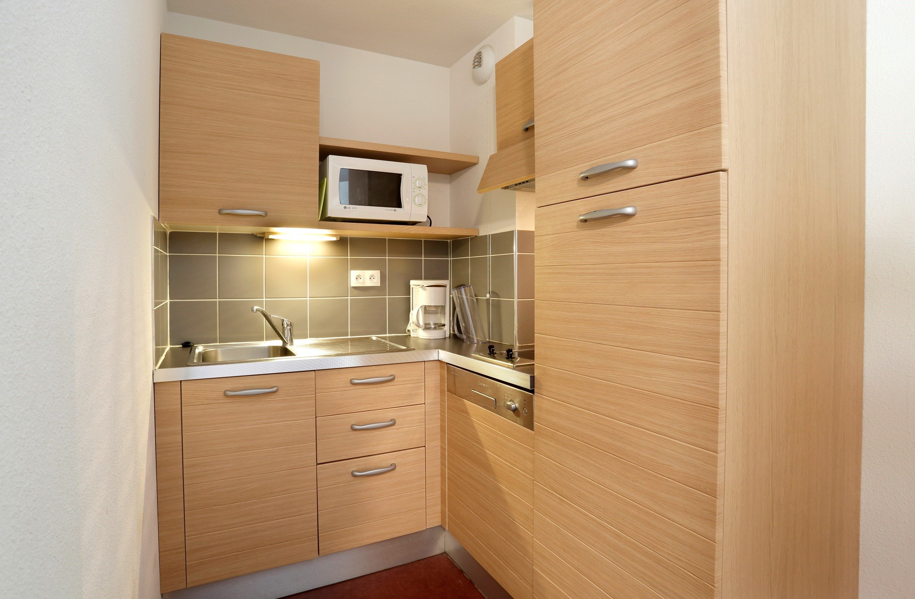 image Cook up a small meal in your kitchenette.