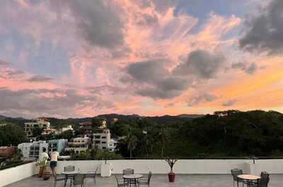 Relax and soak in Sayulita’s evening skies from the shared rooftop terrace.