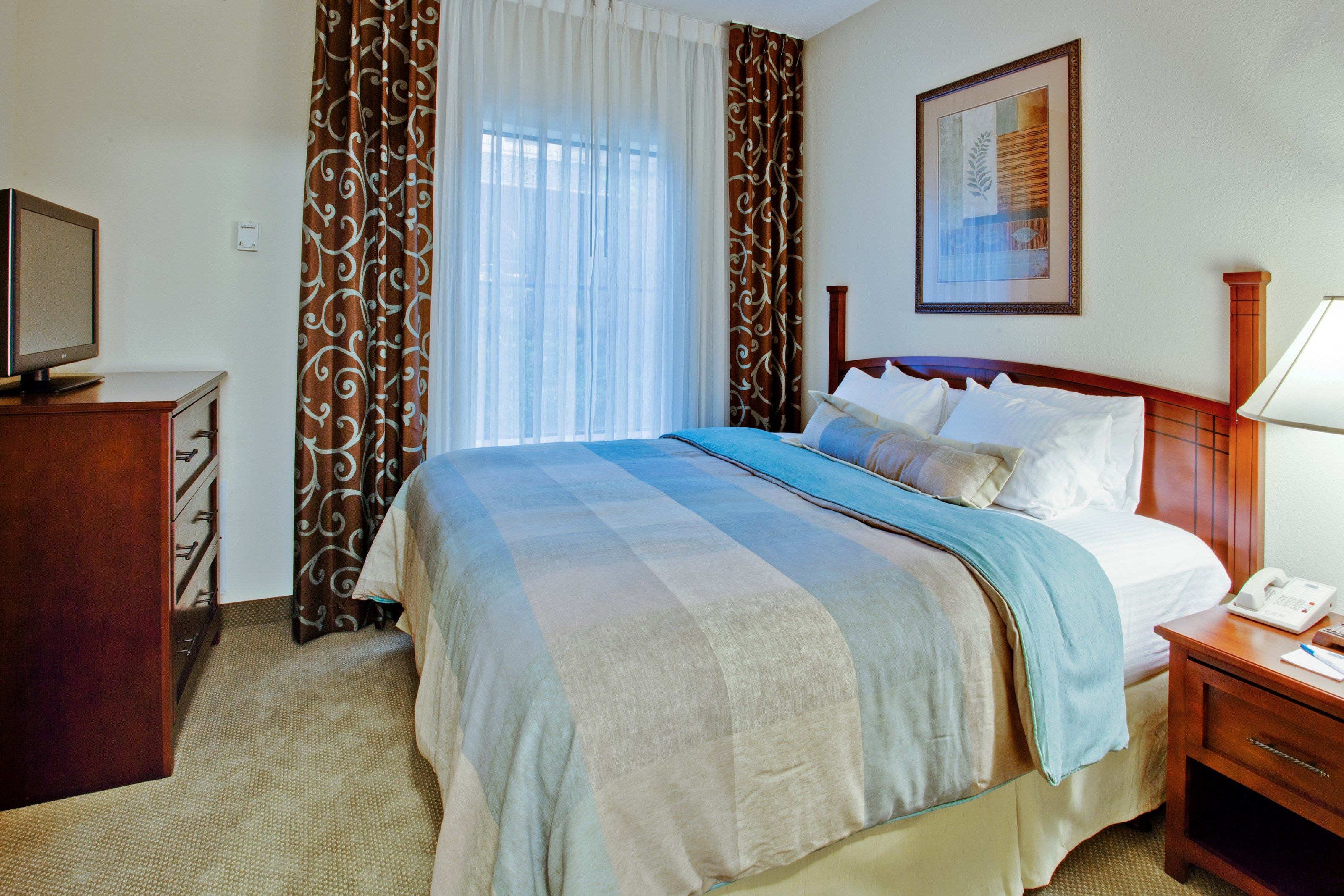image Drift to sleep in the bedroom with a King bed.