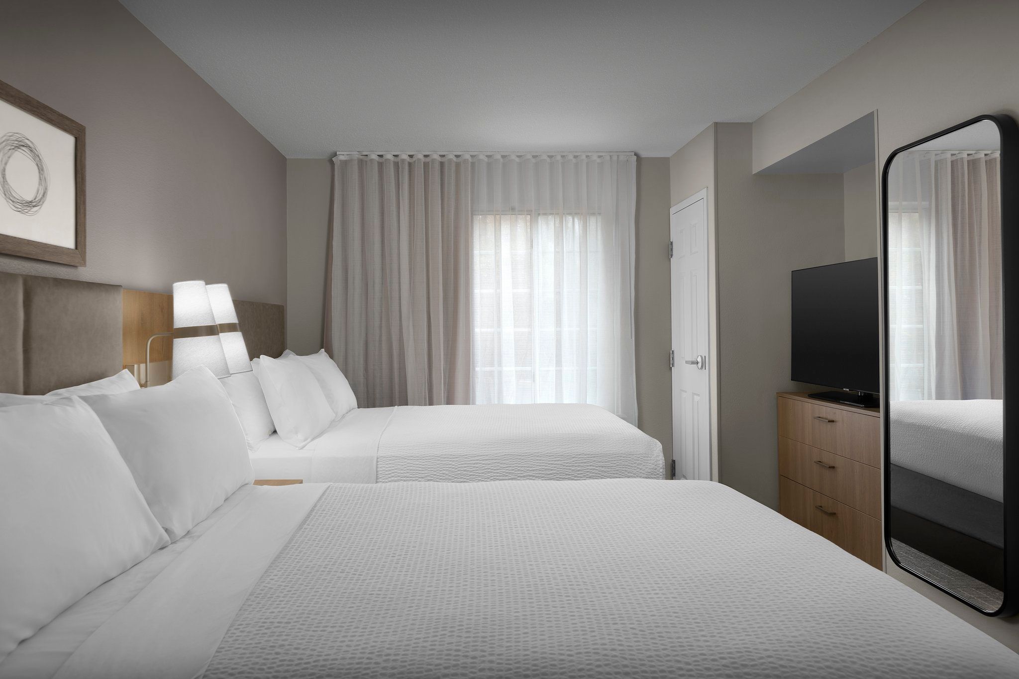 image Unwind in the comfort of two plush double beds, perfect for a restful night's sleep.