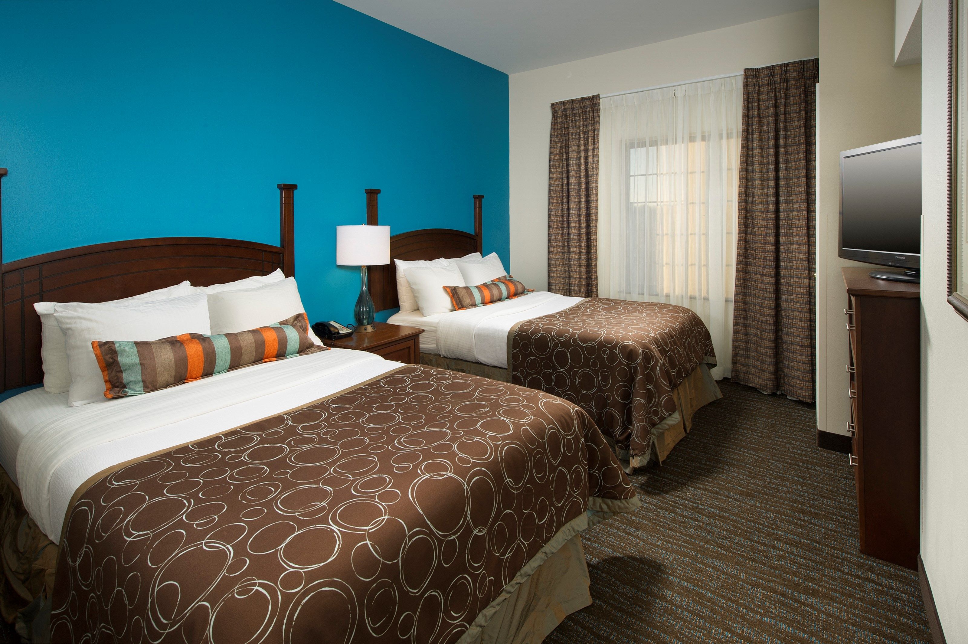 image Drift to sleep in a comfortable bed after a wonderful day outside.