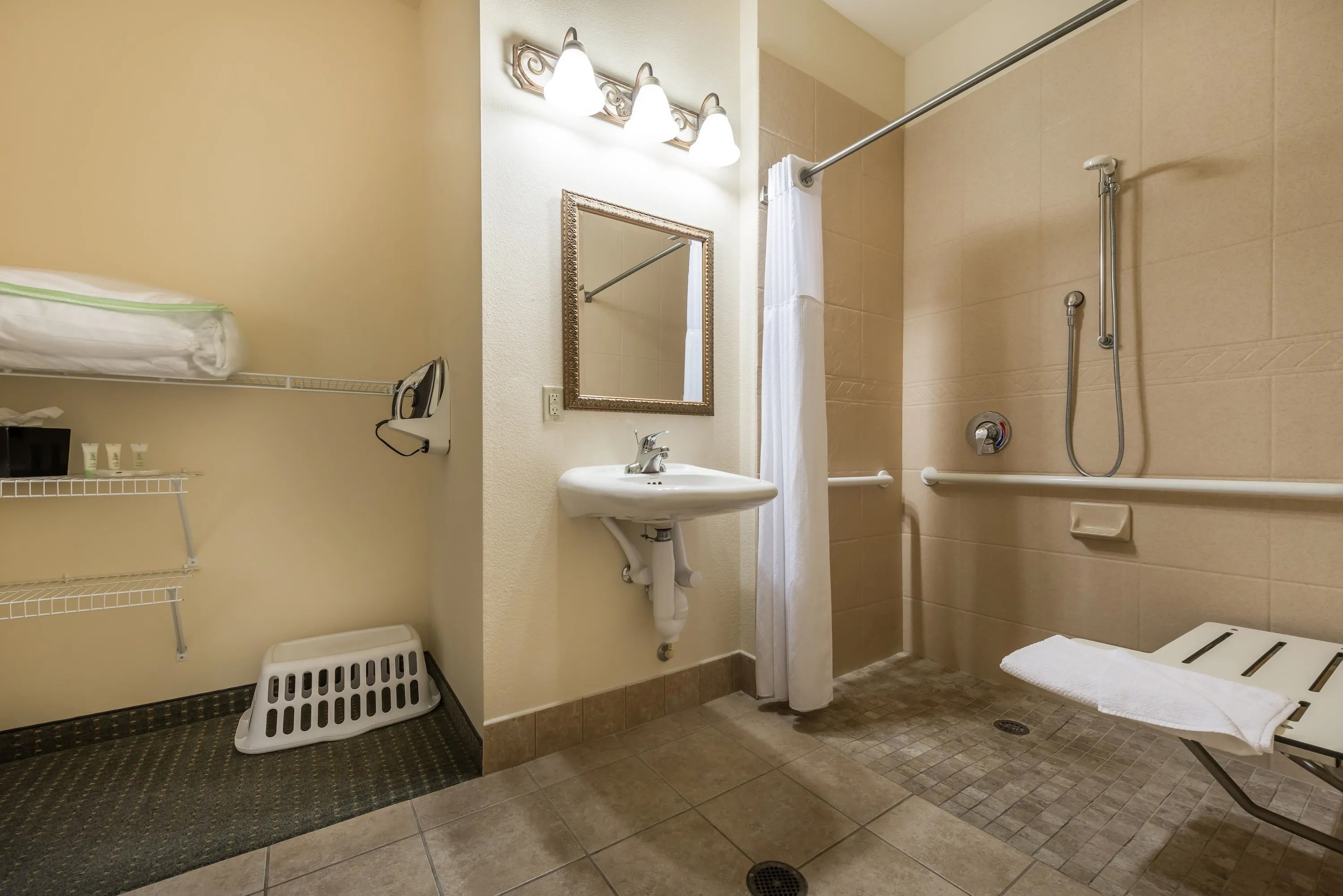 image Accessible bathroom with transfer shower and vanity sink