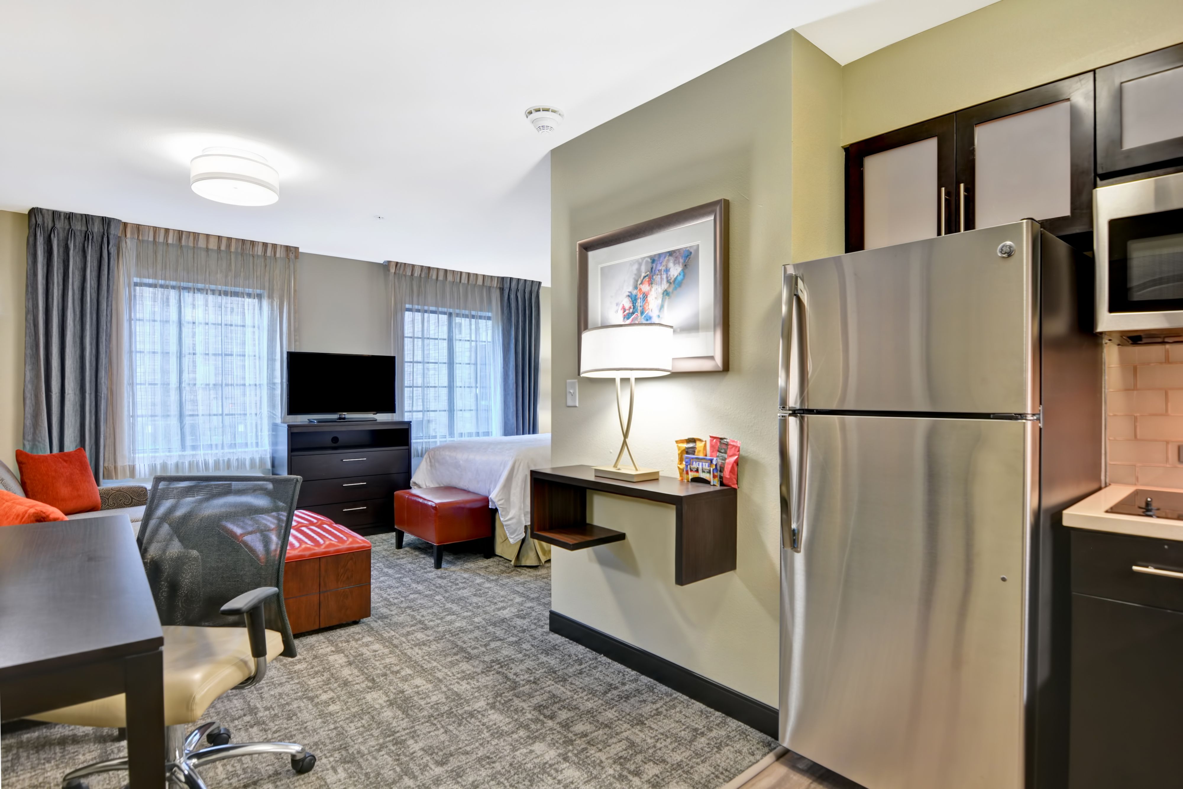image Studio with kitchenette, sofa, and dining area.
