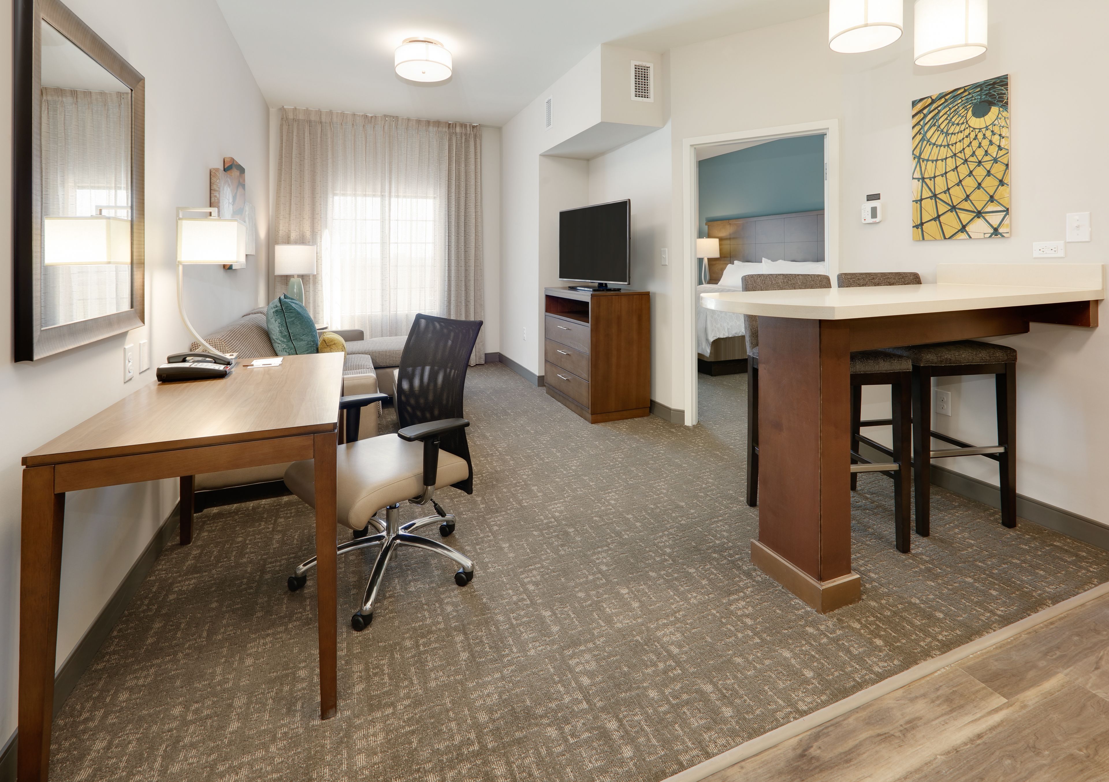 image Cozy living area in a one-bedroom suite perfect for relaxing or work.