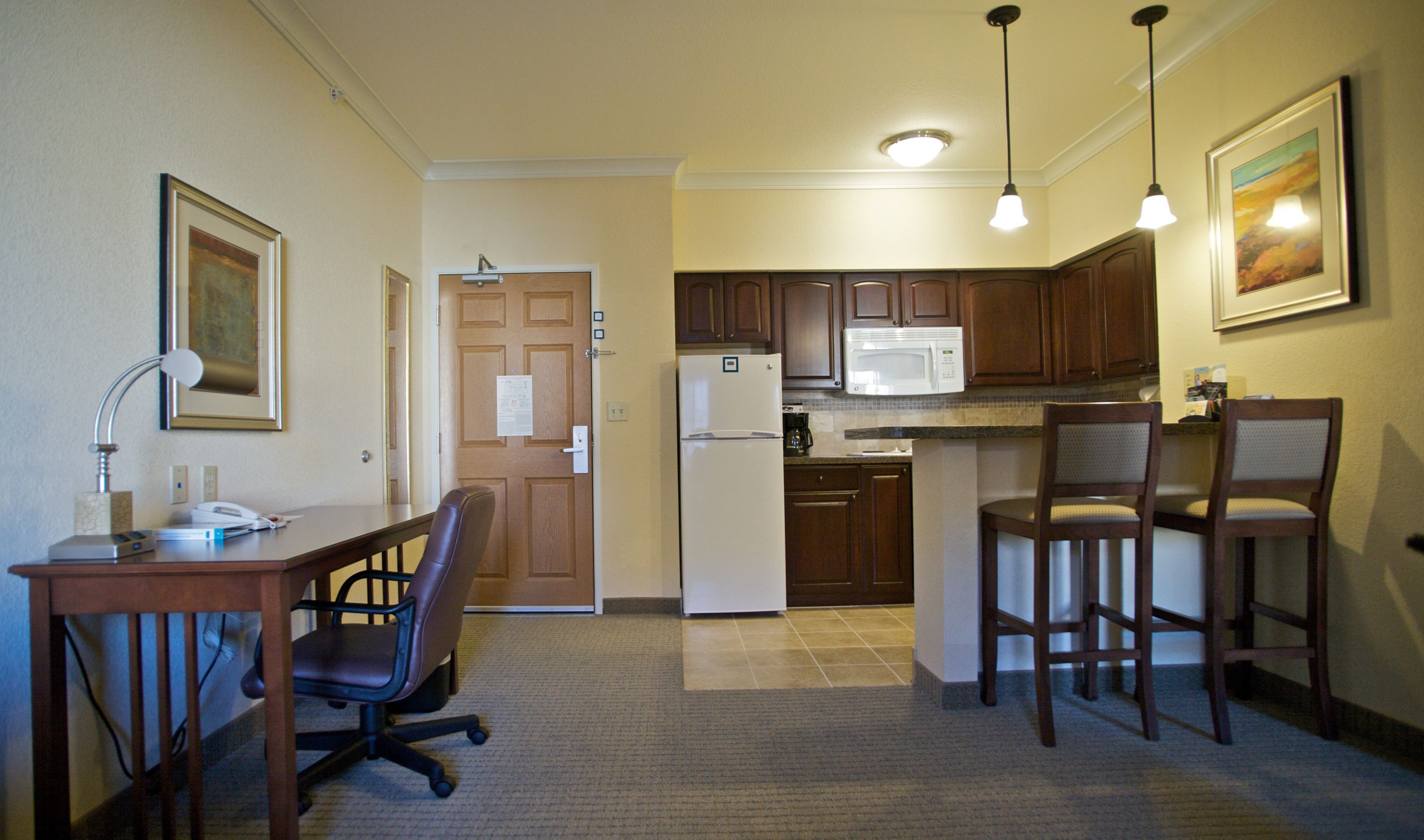 image Bright kitchen area with ample counter space for cooking.