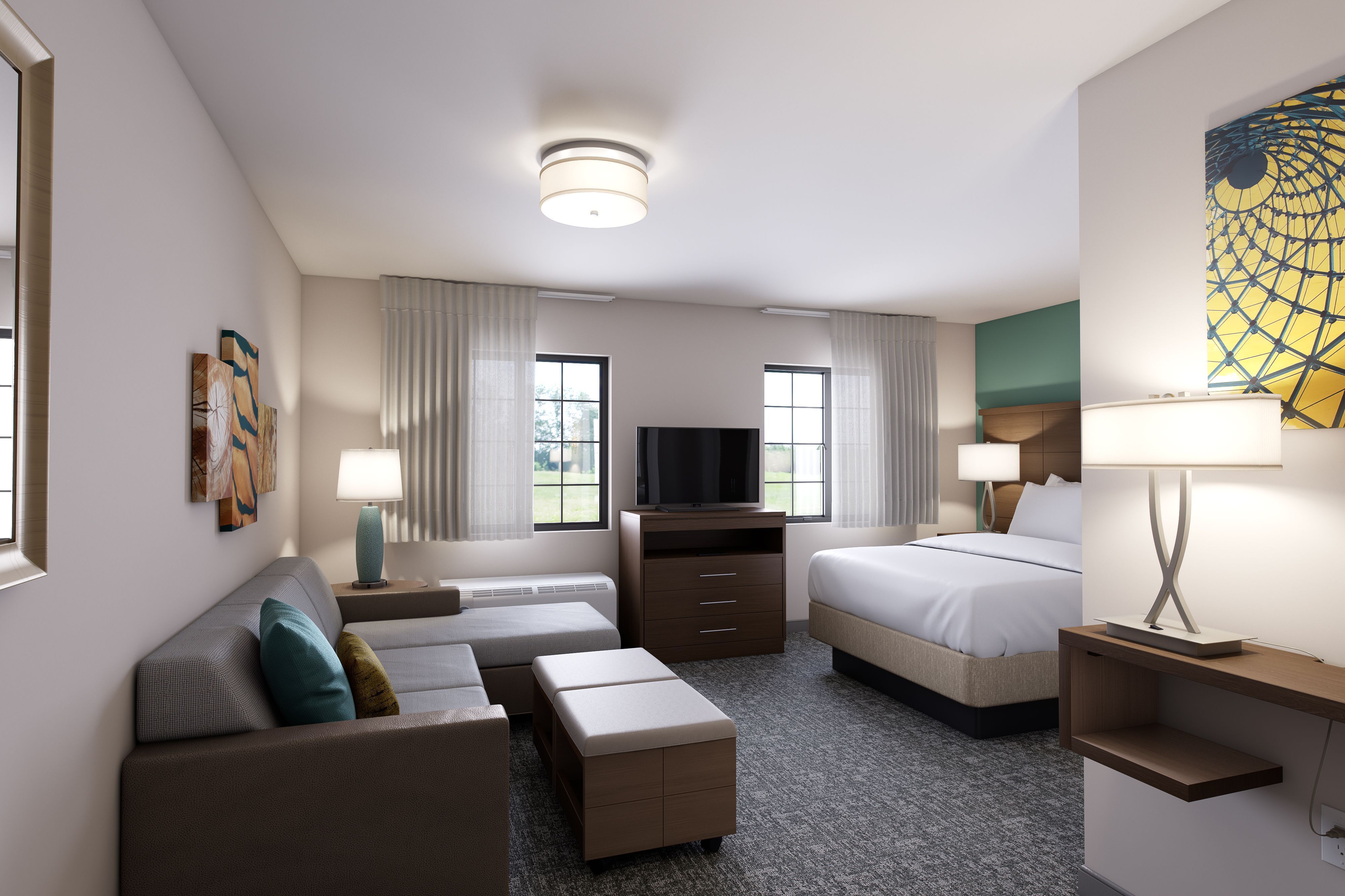 image Experience comfort in the king studio, showcasing a cozy living area and inviting natural light.