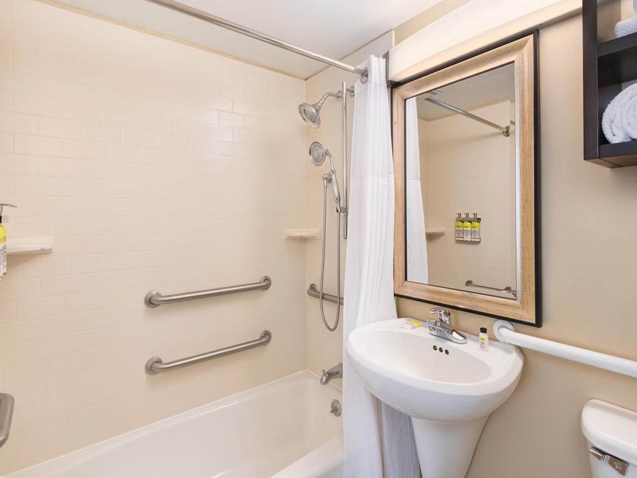 image Accessible bathroom with grab bars and accessible tub.